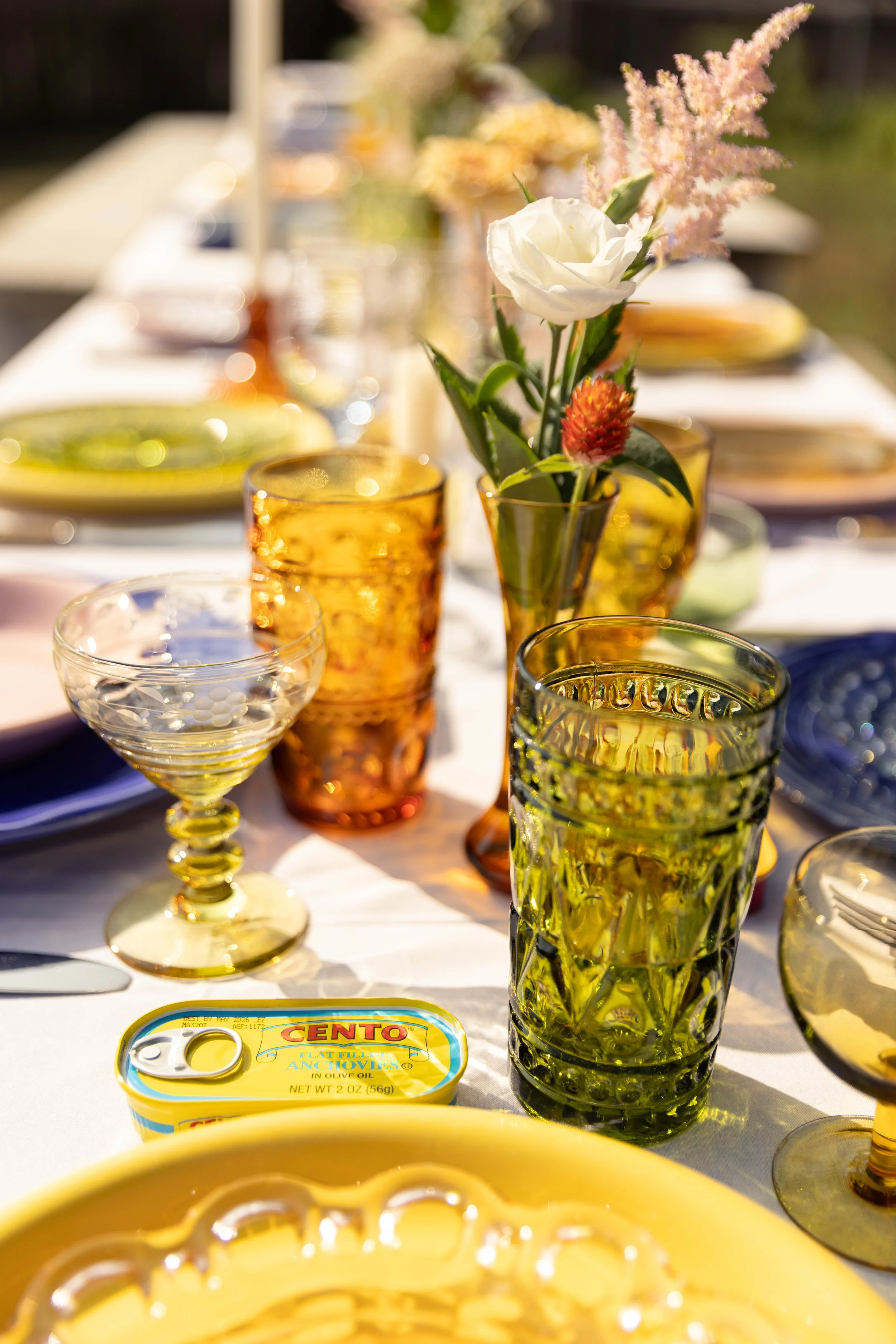 Create the perfect backyard garden party. Colorful tabletop rentals, beautiful vintage glasses, flowers, and custom touches.