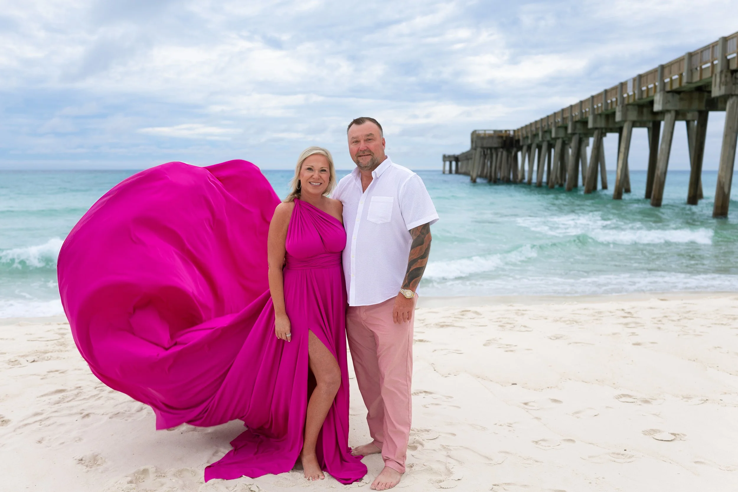 Magenta flying dress pier on beach Florida