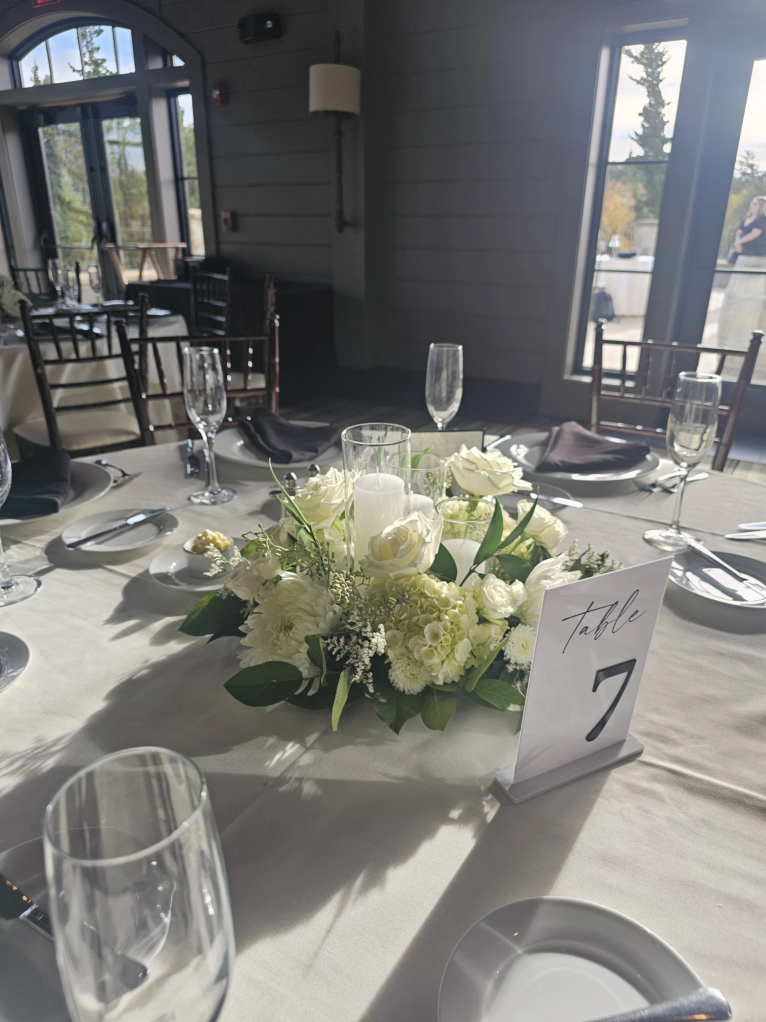 White flower wedding centerpiece NH florist pillar candles