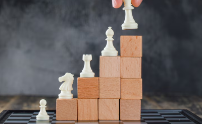 a series of chess pieces arranged on small wooden blocks