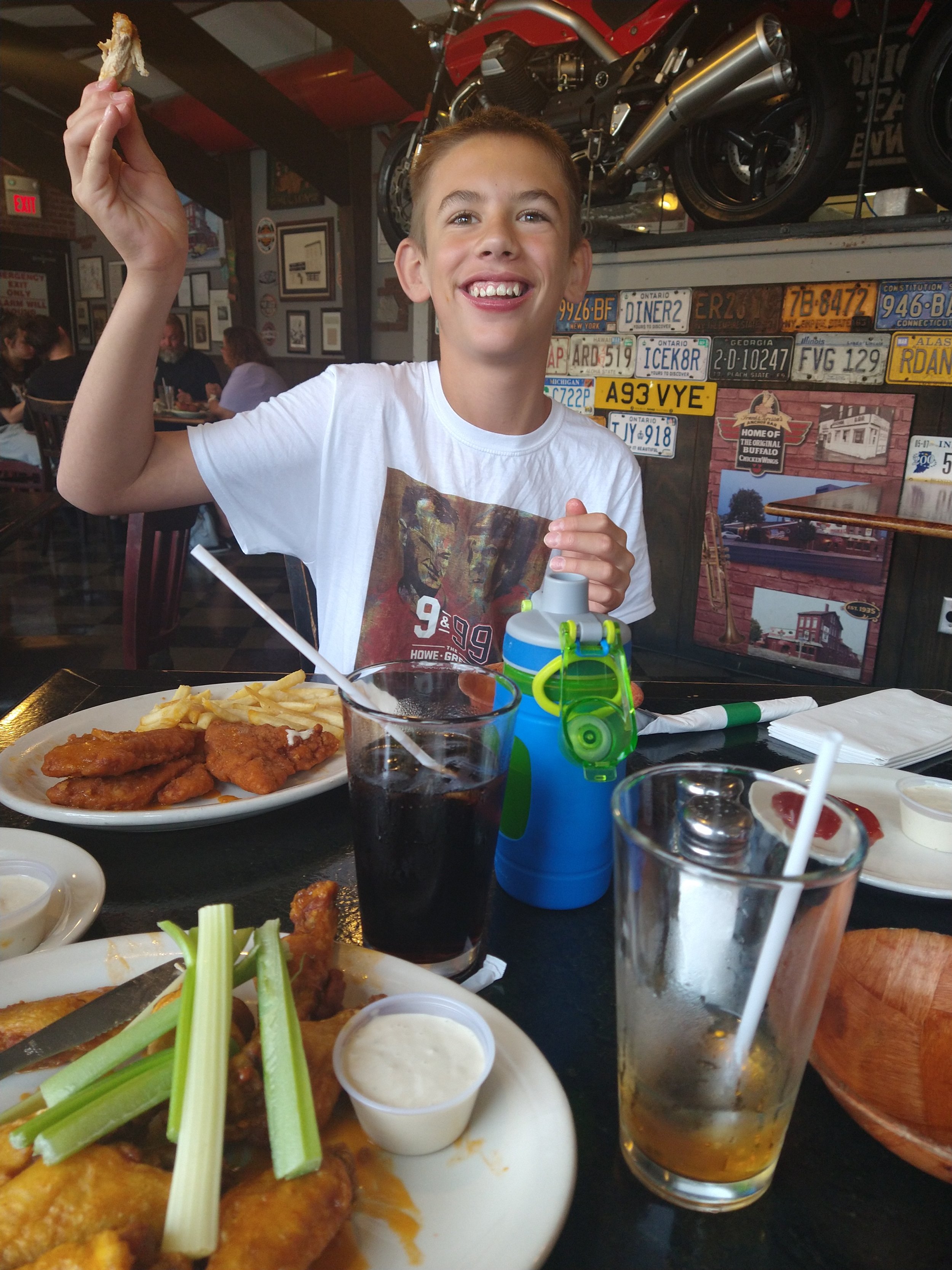 Judah eating wings at the Anchor Bar in Buffalo - 2022