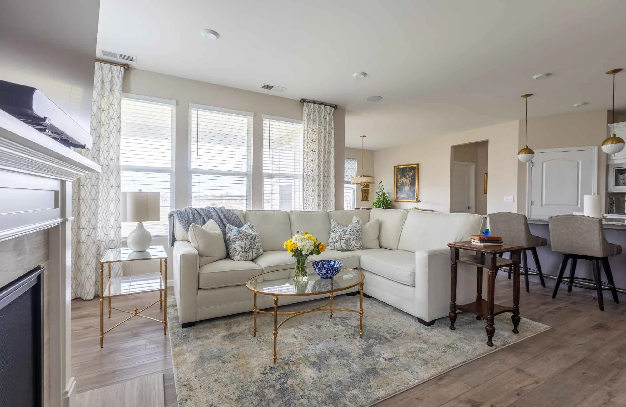 trisha-davis-designs-chicagoland-il-american-made-furniture-living-room-with-white-sectional-large-windows-custom-furnishings-welcoming.jpg