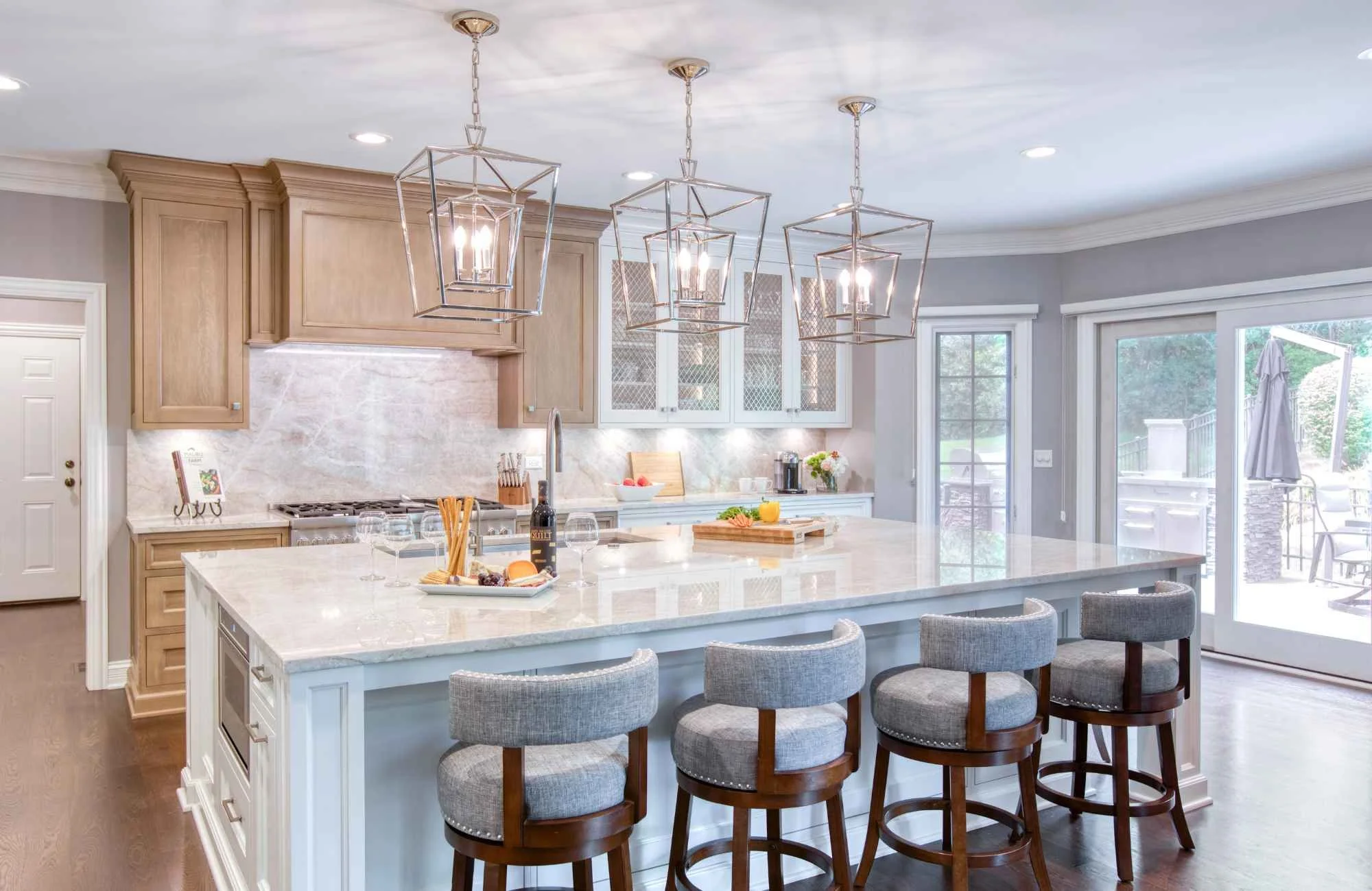trisha-davis-designs-chicagoland-il-color-temperature-lighting-renovated-kitchen-with-large-island-natural-light-stained-wood-cabinets-personal-furnishings.jpg