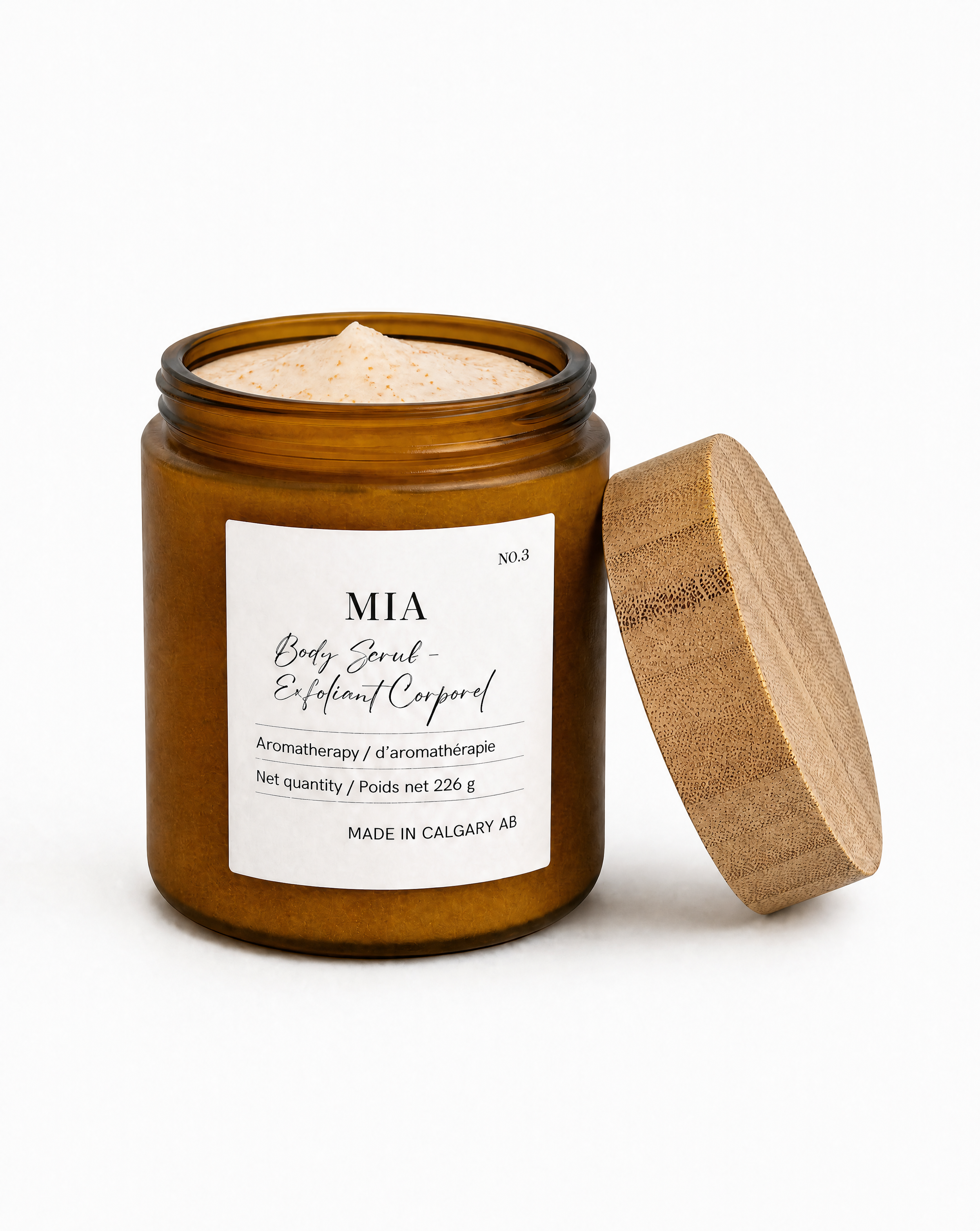 Close-up of Mia Body Milk Scrub texture showing finely ground natural apricot shells for precision skin resurfacing.