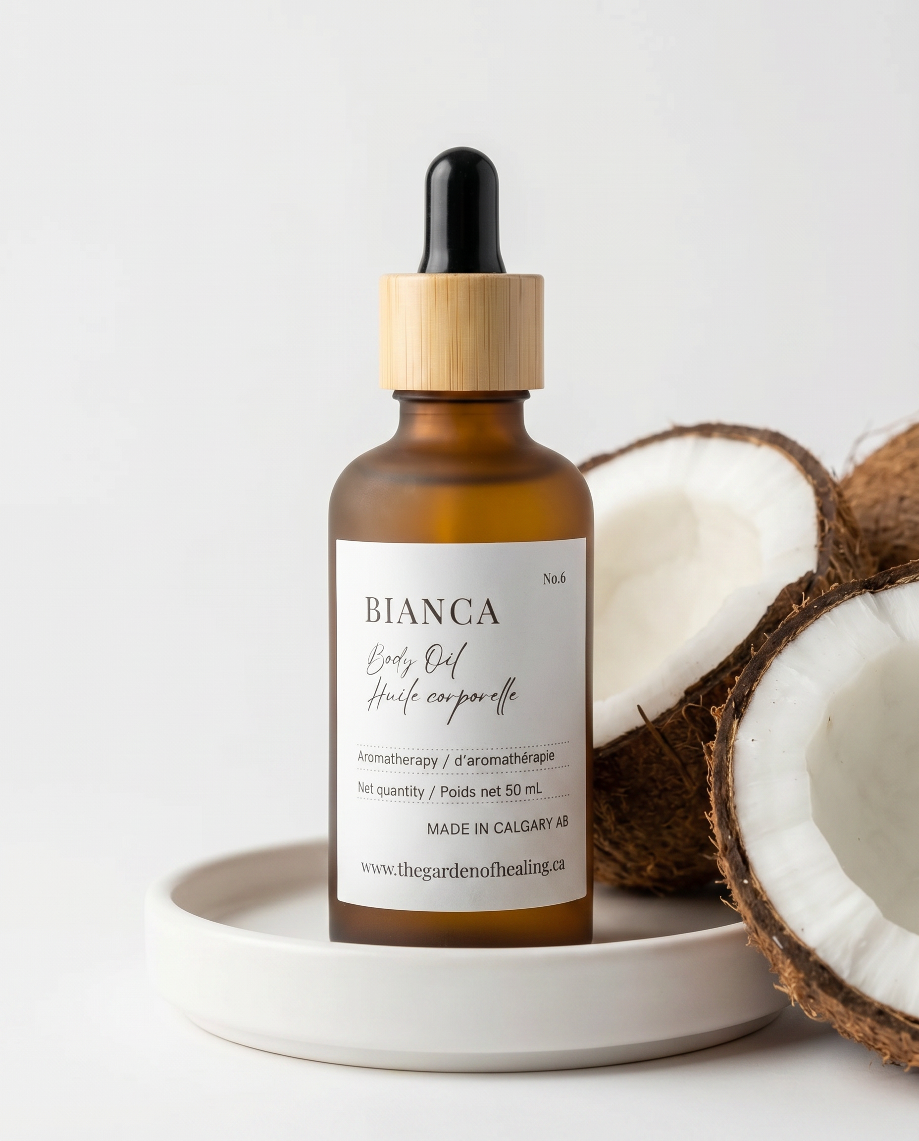 Bianca body oil, spiced coconut body oil, peach vanilla body oil, cinnamon scented body oil, warm tropical body oil, natural hydrating body oil, luxury body moisturizer.