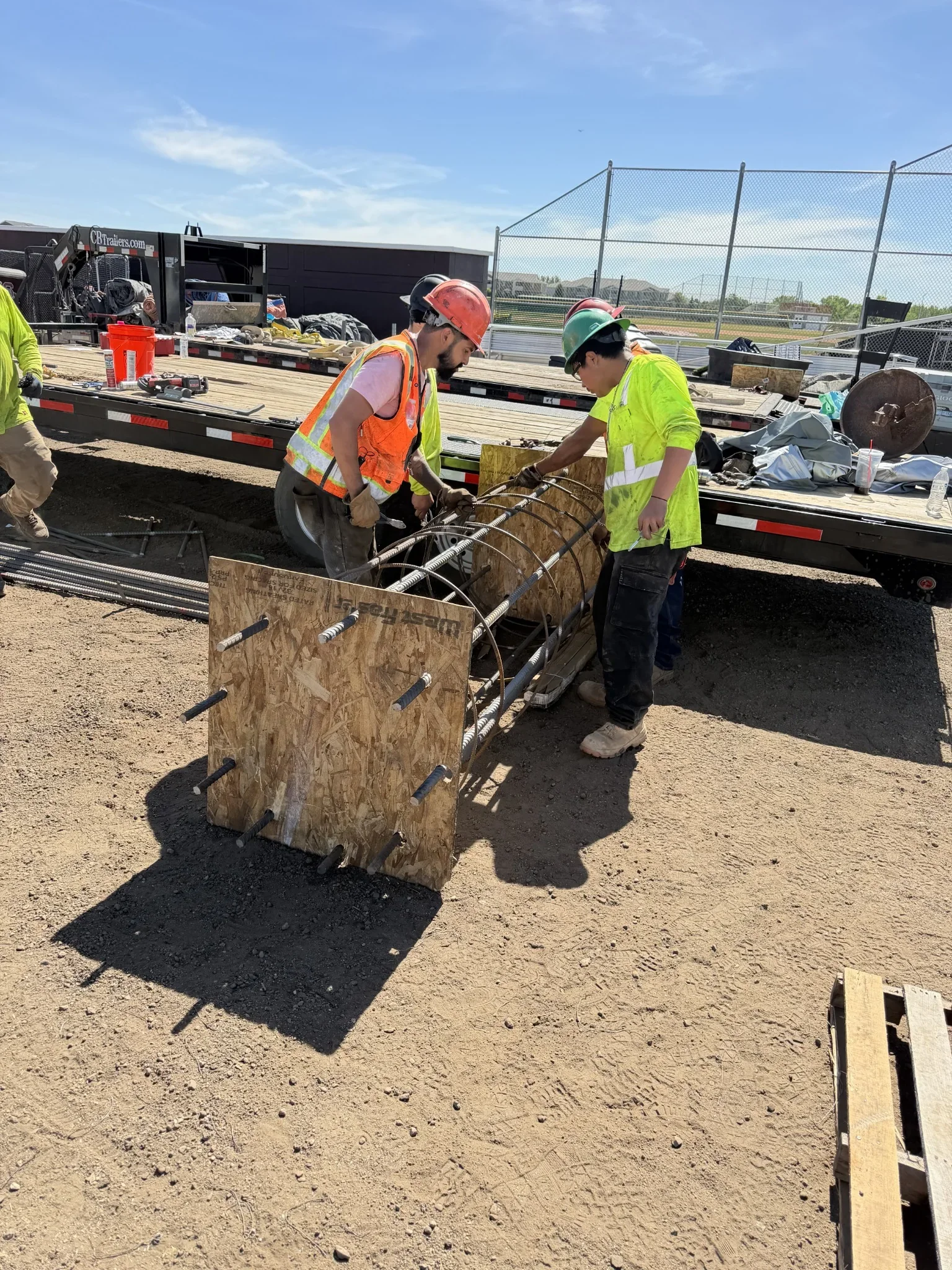 Perez Drilling crew tying steel reinforcement for a drilled caisson foundation cage in Colorado.