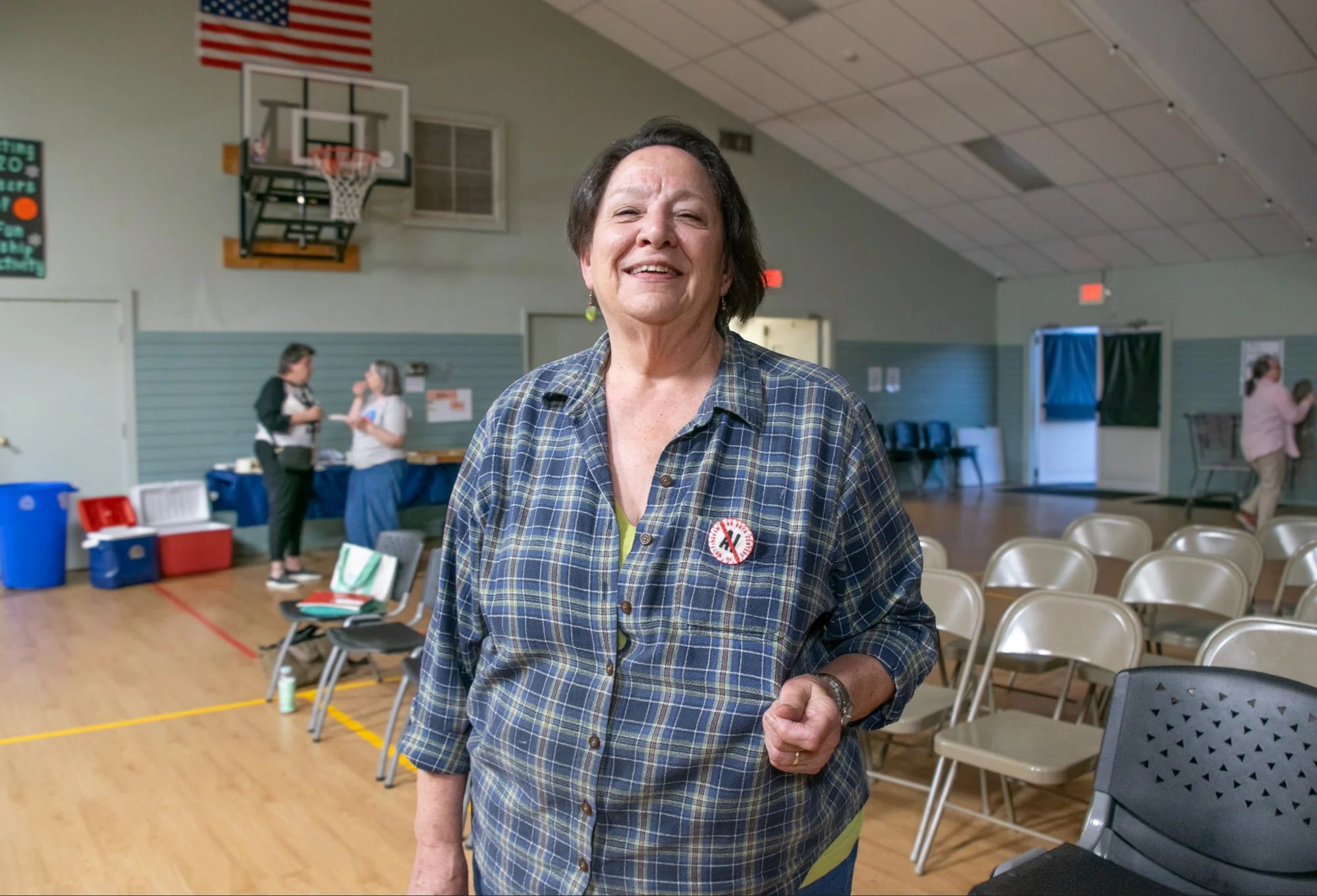 Carolyn Morse-Finn, a Nottingham resident, wears a handmade button that reads "No data centers in Nottingham," embroidered by Nottingham local Annette O'Neil's daughter, Maggie O'Neil. Grace Chai/Seacoastonline