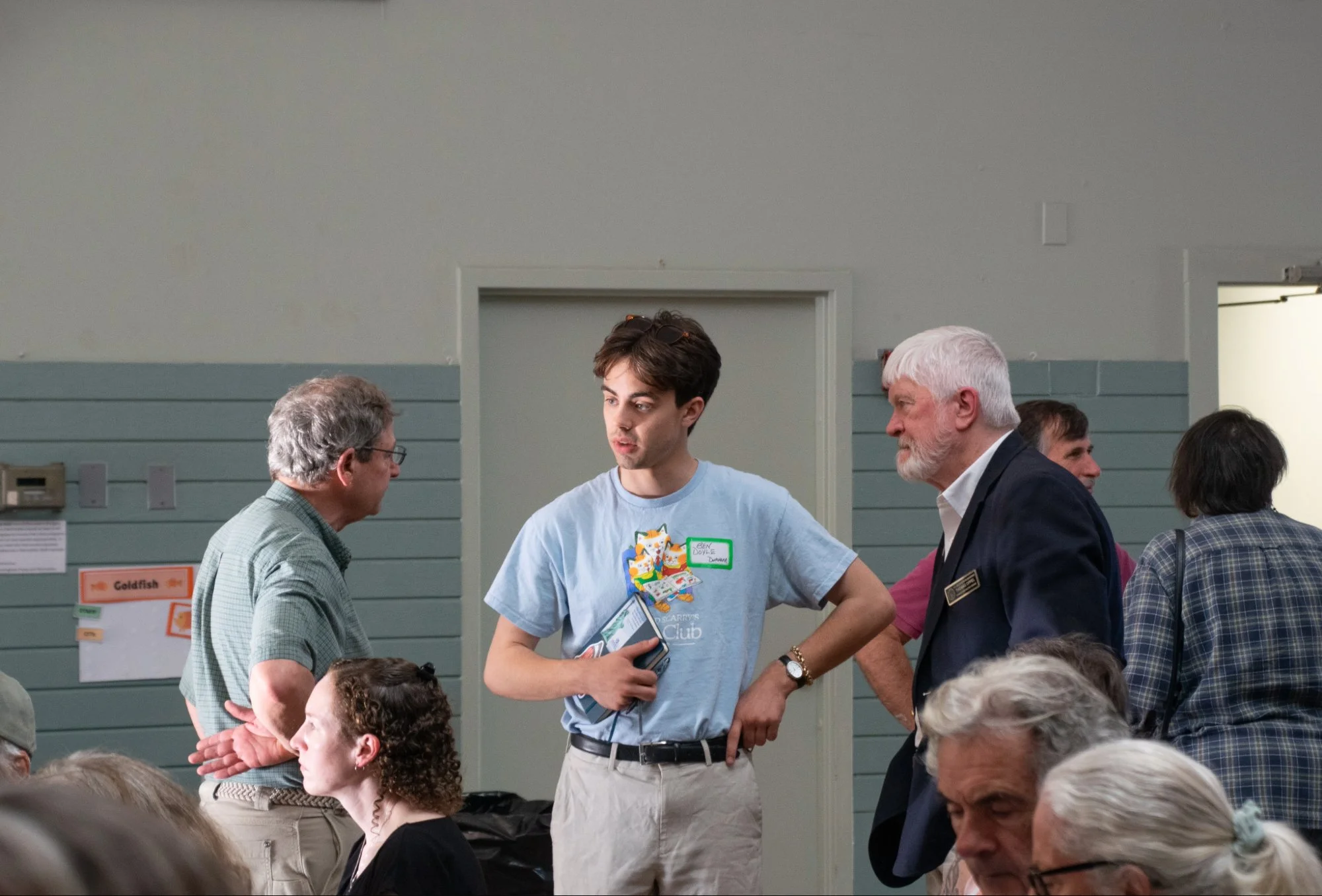 Ben Doyle of Durham (center) talks with State Rep. Tom Cormen, D-Lebanon (left) and state Rep. Thomas Oppel, D-Canaan (right), at the community meeting opposing data centers.