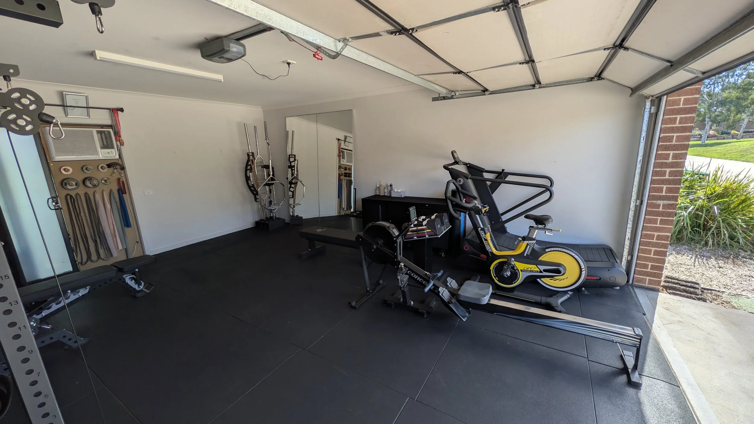 Yes it's a garage gym in Australia. But it's honestly the best layout 've ever seen. Photo shows ample space for floor work, stretching, mobility and potential for group fitness classes