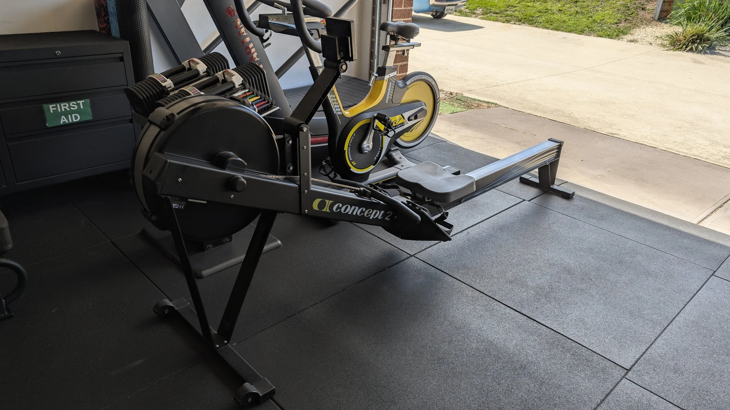 Concept 2 rowing machine, GR7 stationary spin/ cycle bike and curved treadmill. The Cardio corner where cardiovascular training is done or warm ups prior to effective resistance training sessions. Sometime we arrive to personal training very tired