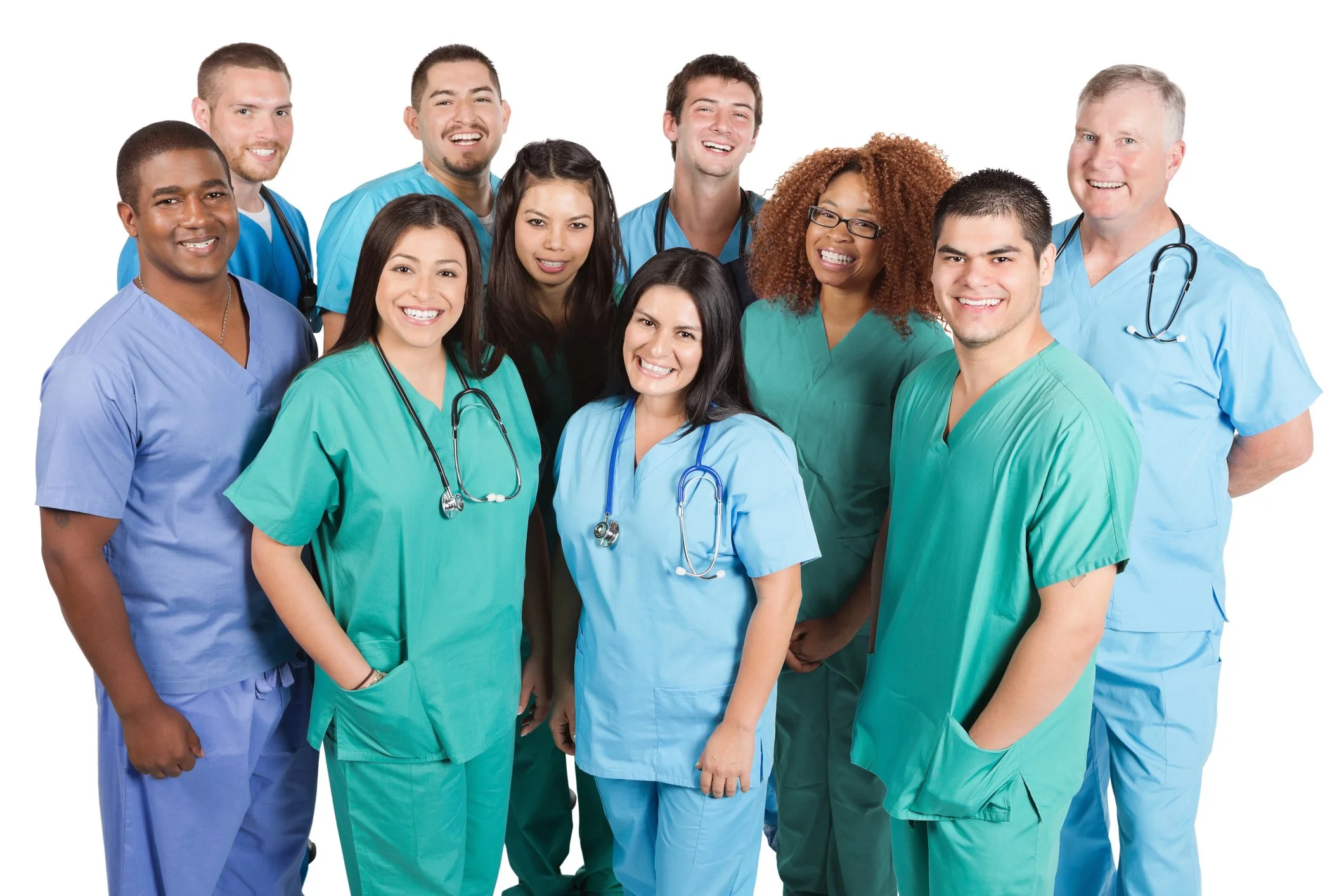Group of diverse healthcare professionals in scrubs smiling at the camera.