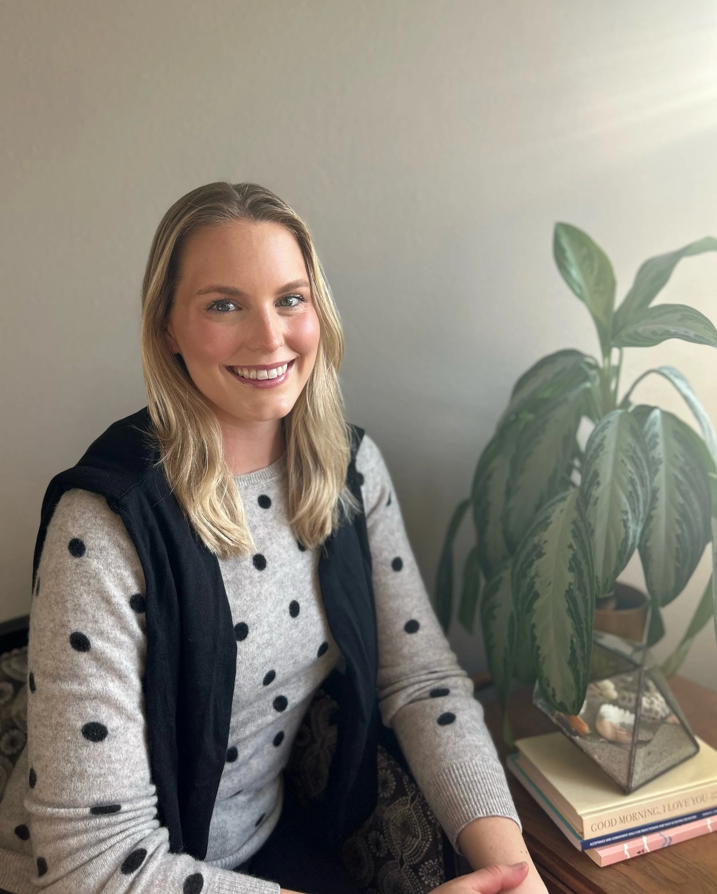 Compassionate therapist sitting in sweater, offering anxiety therapy in san francisco