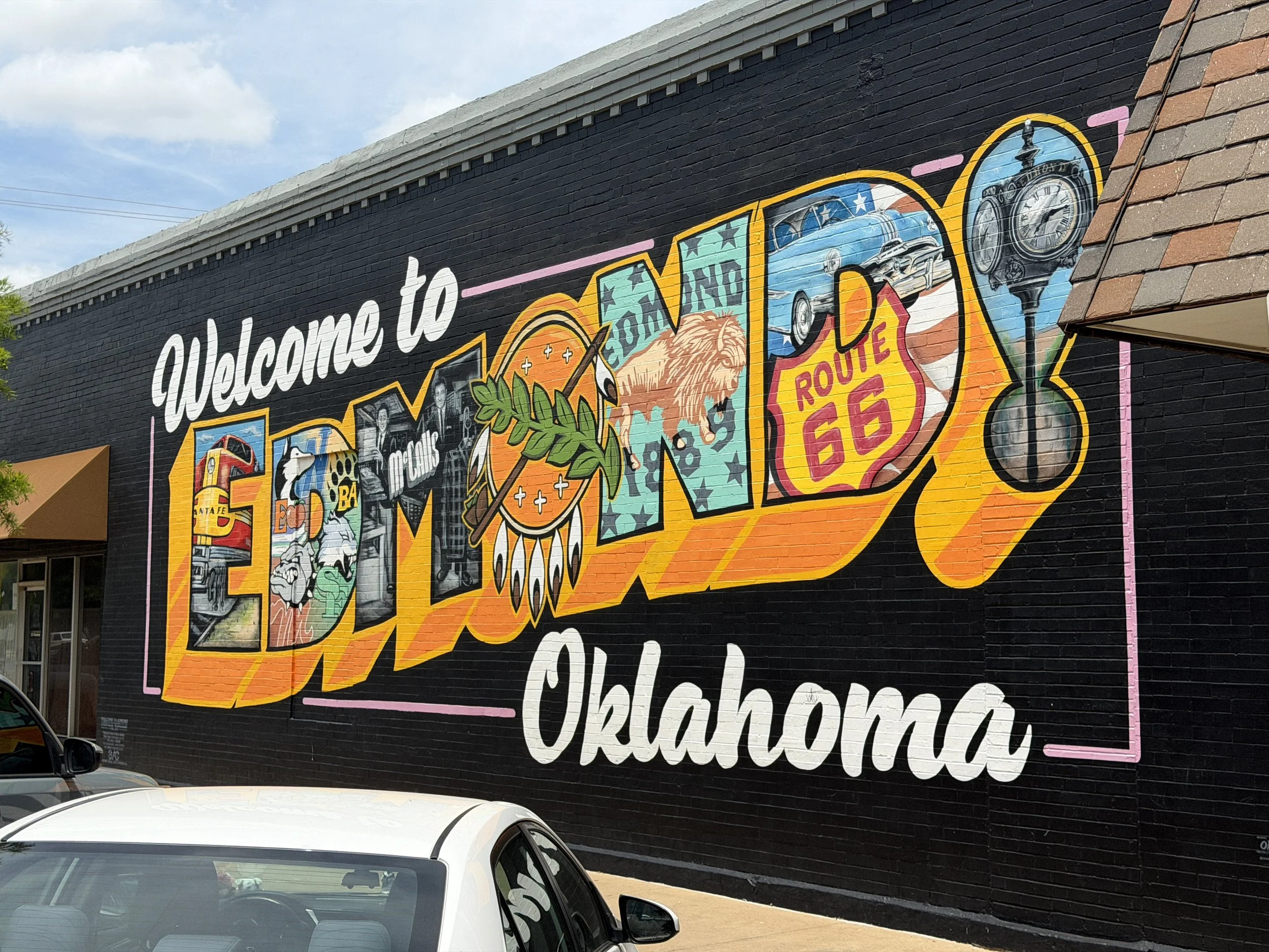 Colorful Welcome to Edmond, Oklahoma mural featuring Route 66 artwork