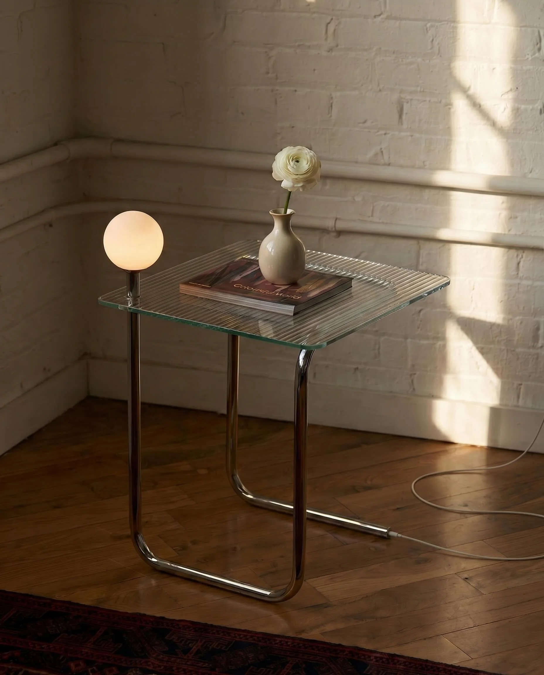 Glow Side Table 

The side table lamp problem: find one that matches, style the cord, remember to charge it. Or &mdash; just get a table with the light already in it. 

We have one available with ribbed glass and one with clear glass in the studio. C
