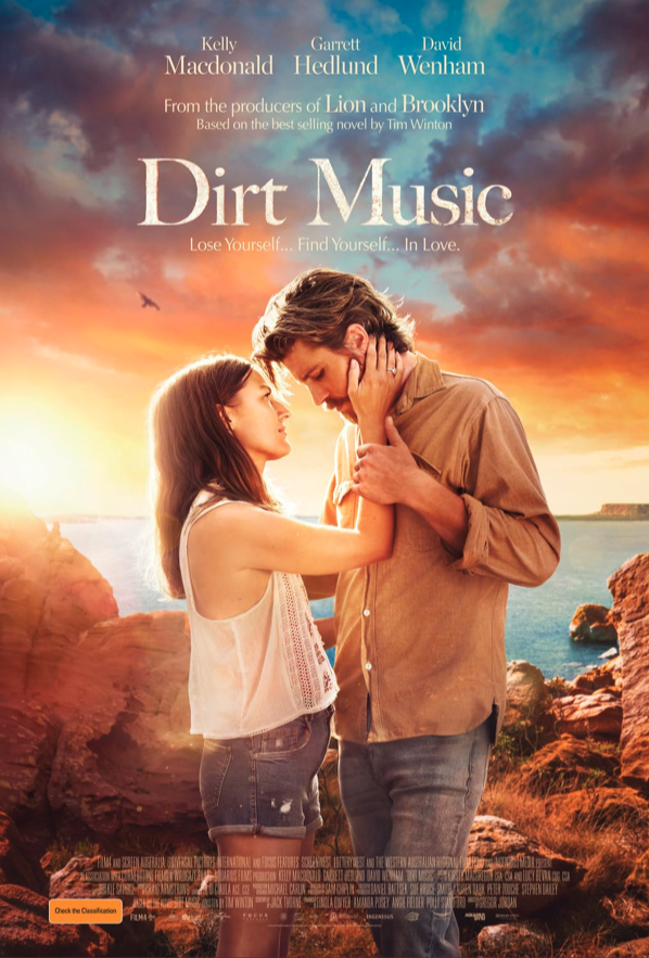 Movie poster for 'Dirt Music' showing a man and woman standing close, touching faces with a scenic coastline and sunset in the background