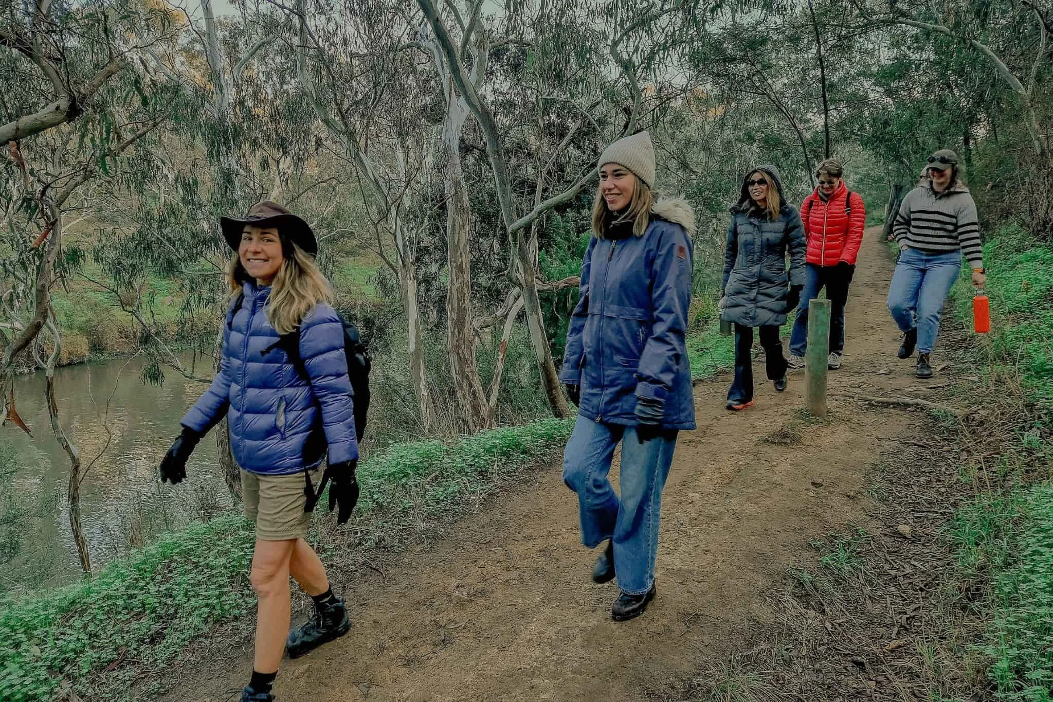 tour with visitors walking the yarra bend trails