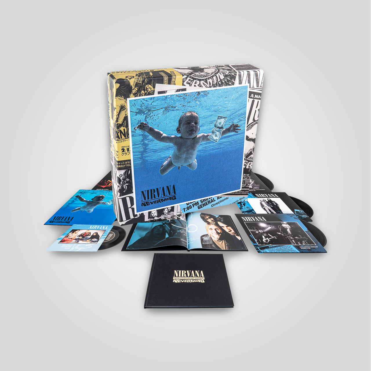 Une édition en coffret de Nirvana, comprenant un album, des photos, des magazines et une boîte en cuir, avec une image emblématique du groupe.