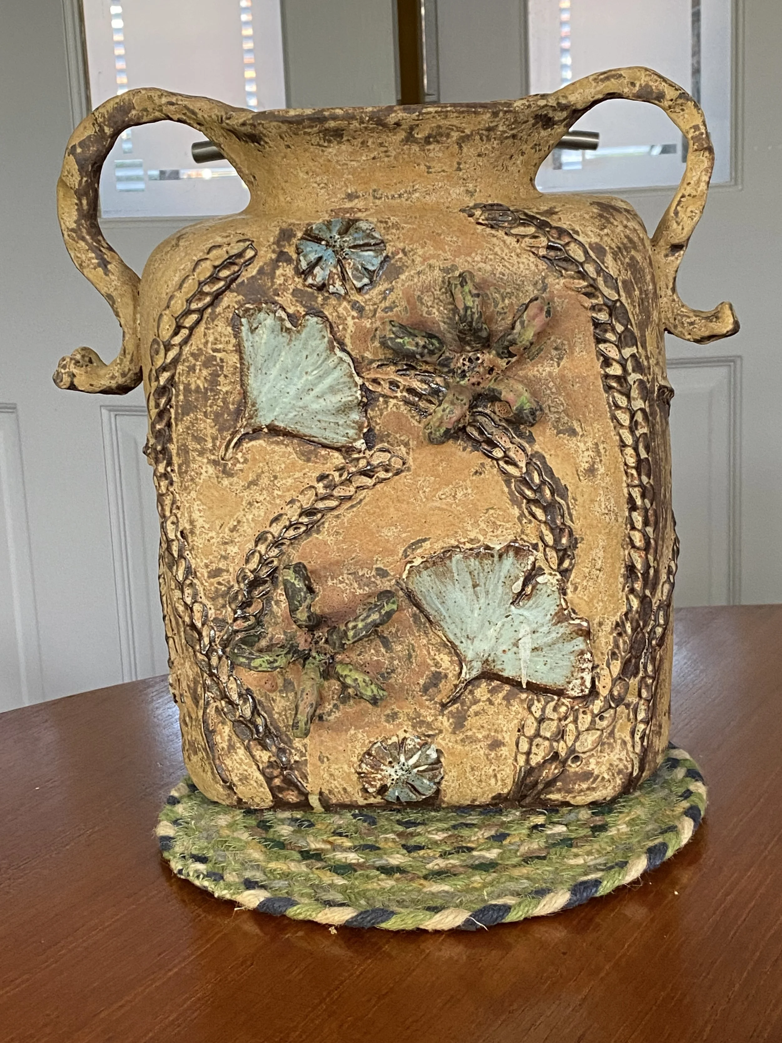 Surface decorated stoneware urn