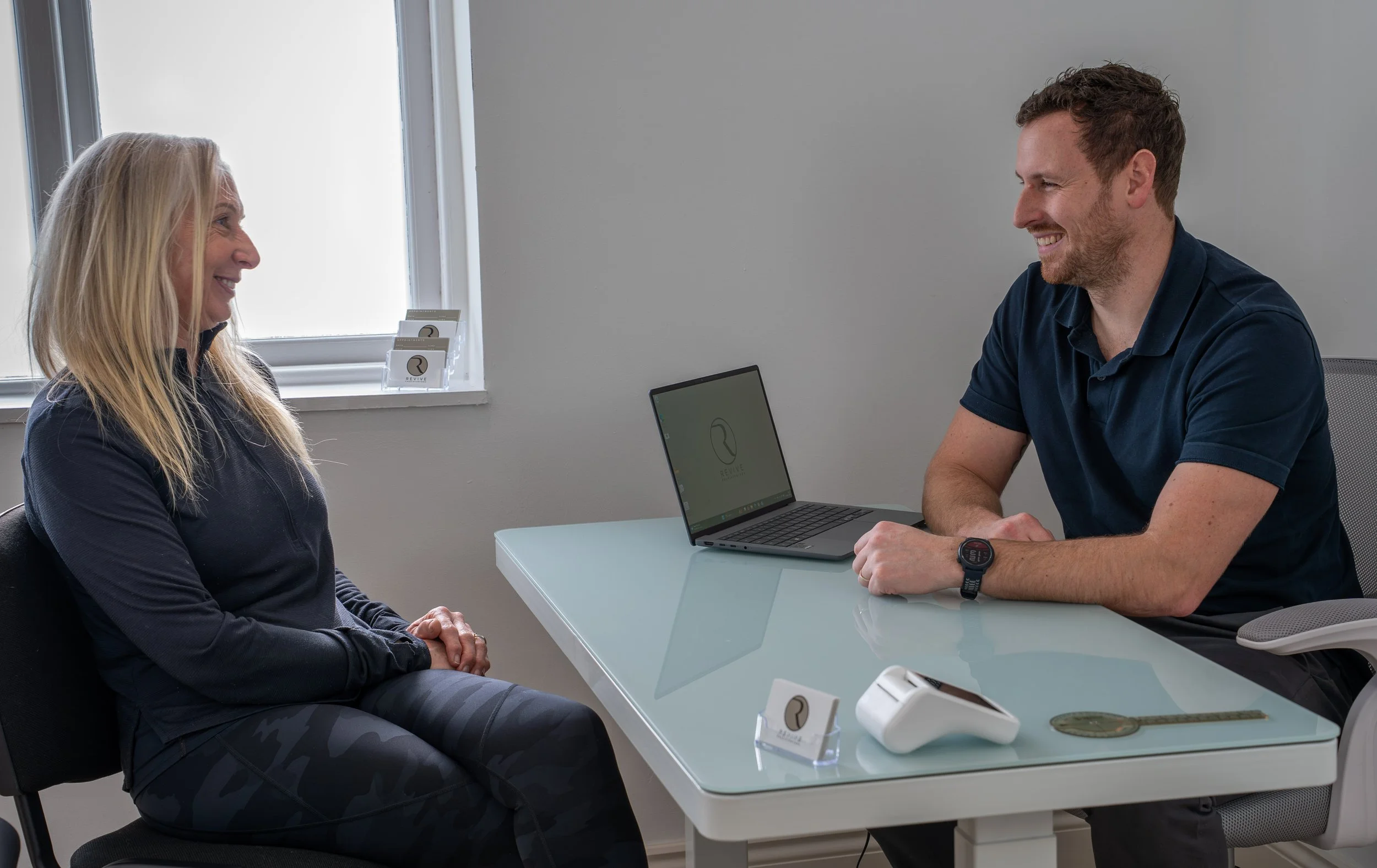 Rob Bale of Revive Physio Cornwall during a patient consultation.