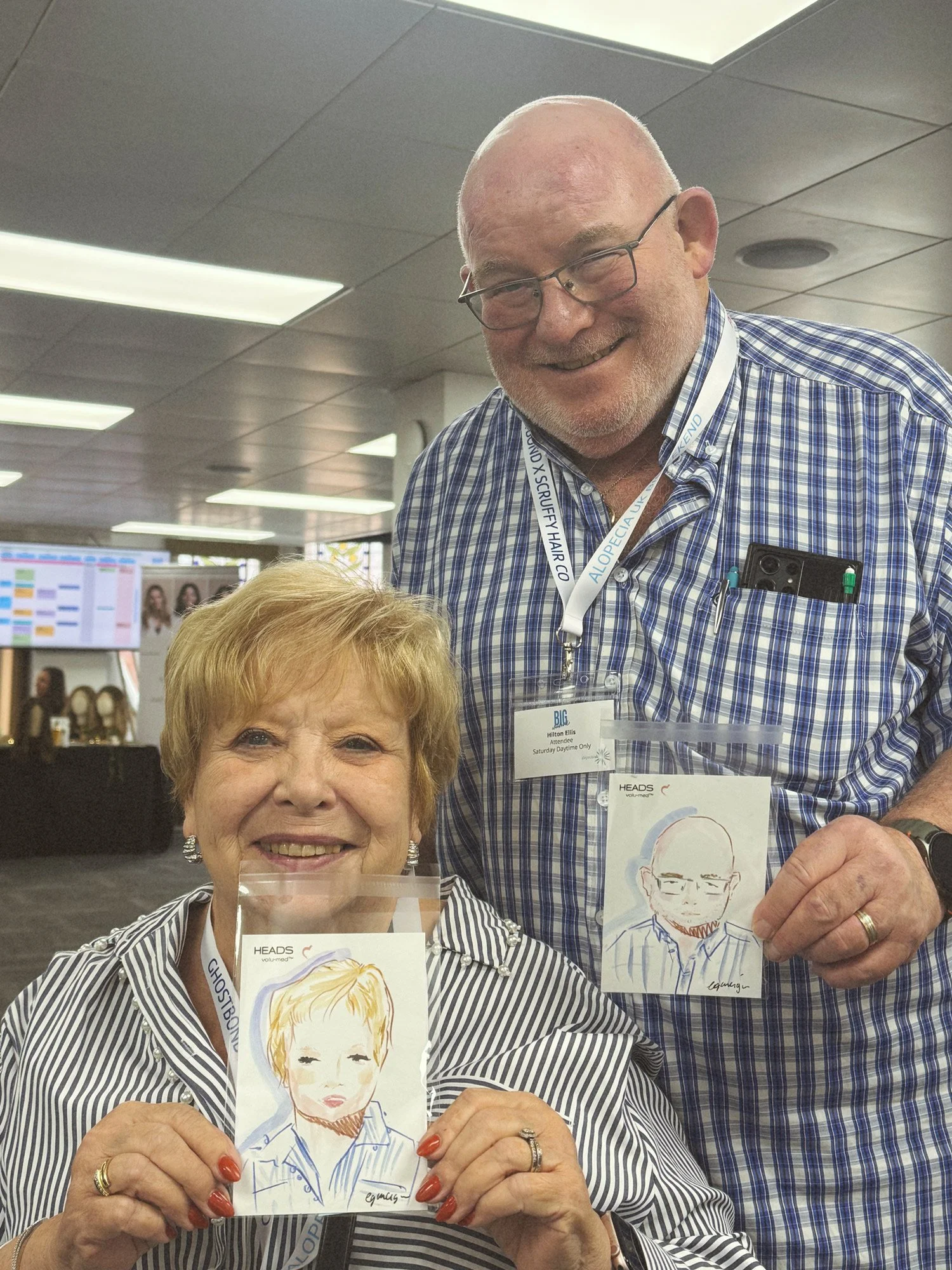 Live illustration of elderly couple by Eduard Illustrates at an event in Birmingham