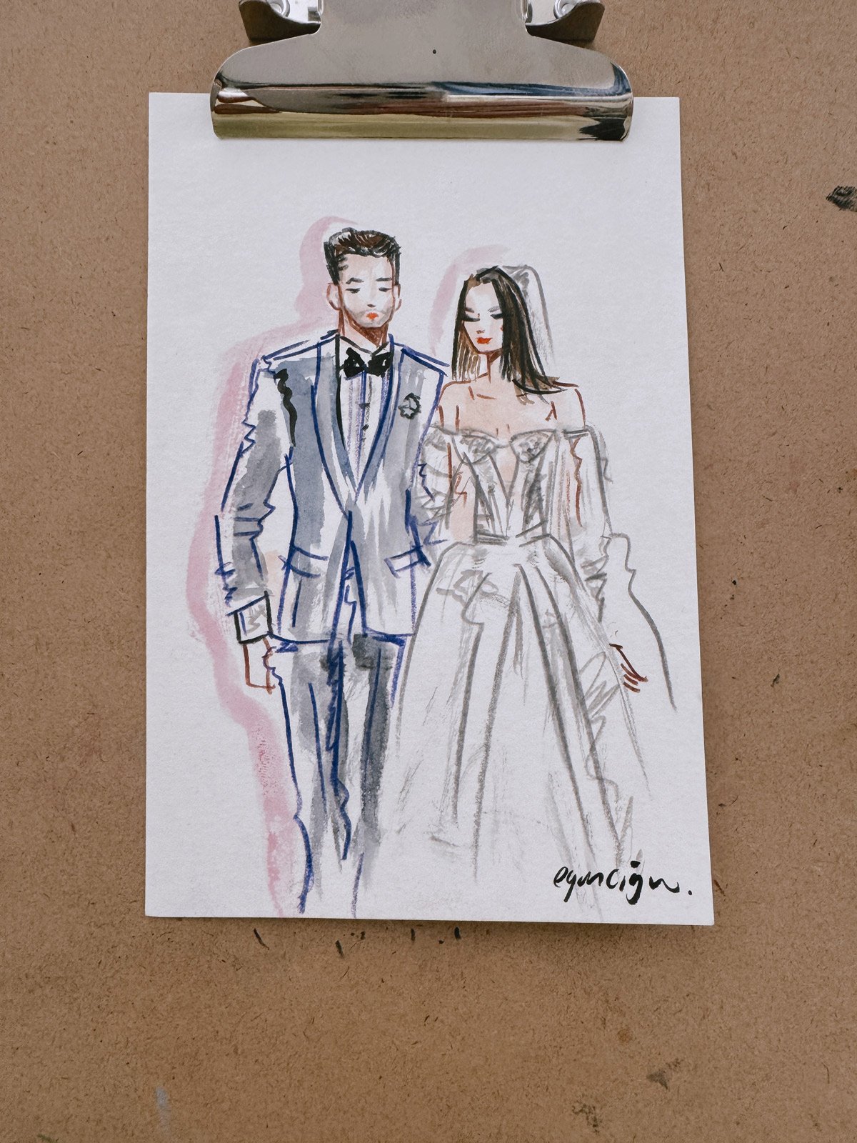 A hand-drawn illustration by Eduard Illustrates of a man and woman in formal wedding attire, attached to a brown clipboard.