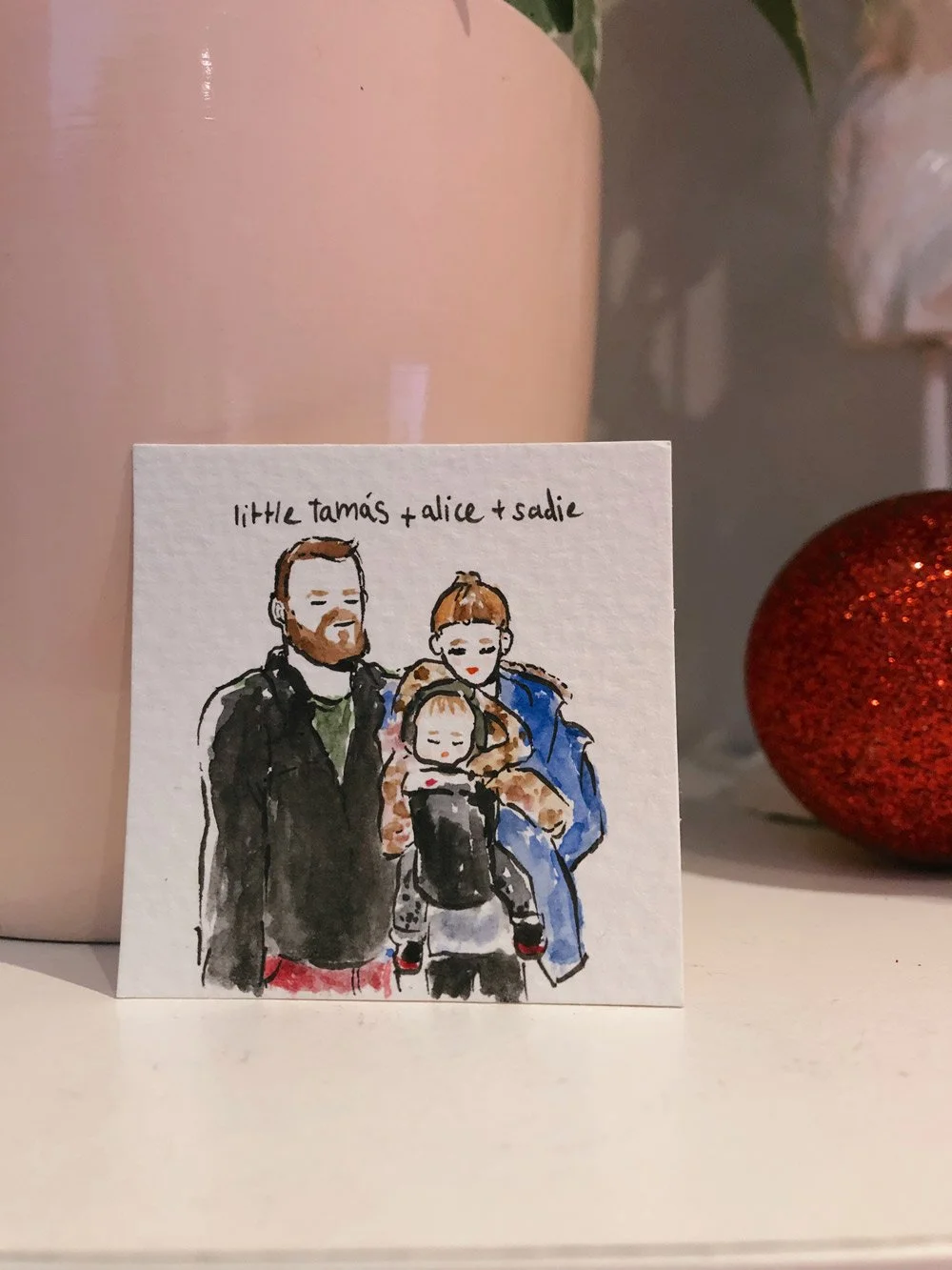 A hand-drawn illustration of a family with three members, labeled "little tomás + alice + sadie," by Eduard Illustrates