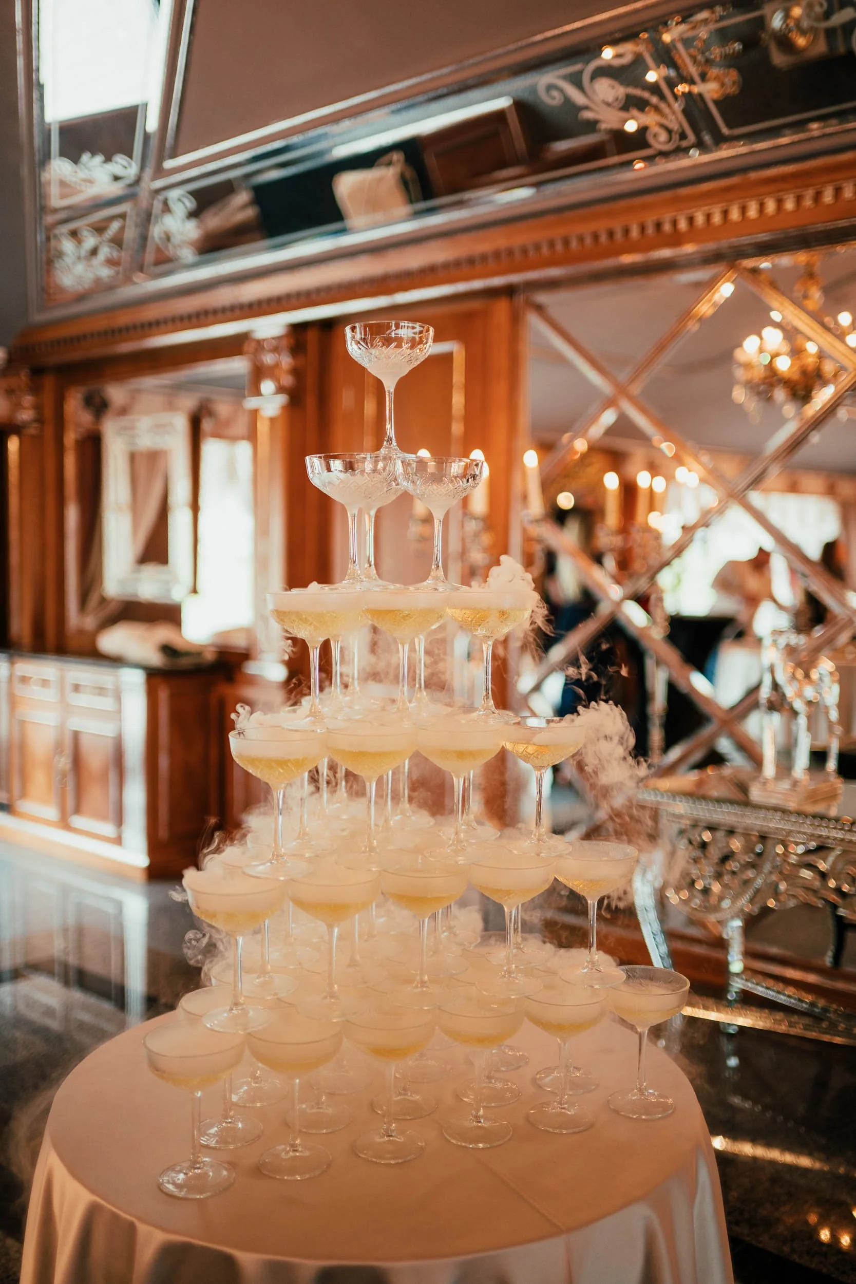Glamorous champagne tower at a luxurious wedding reception – modern, elegant documentary detail by Studio Aelina