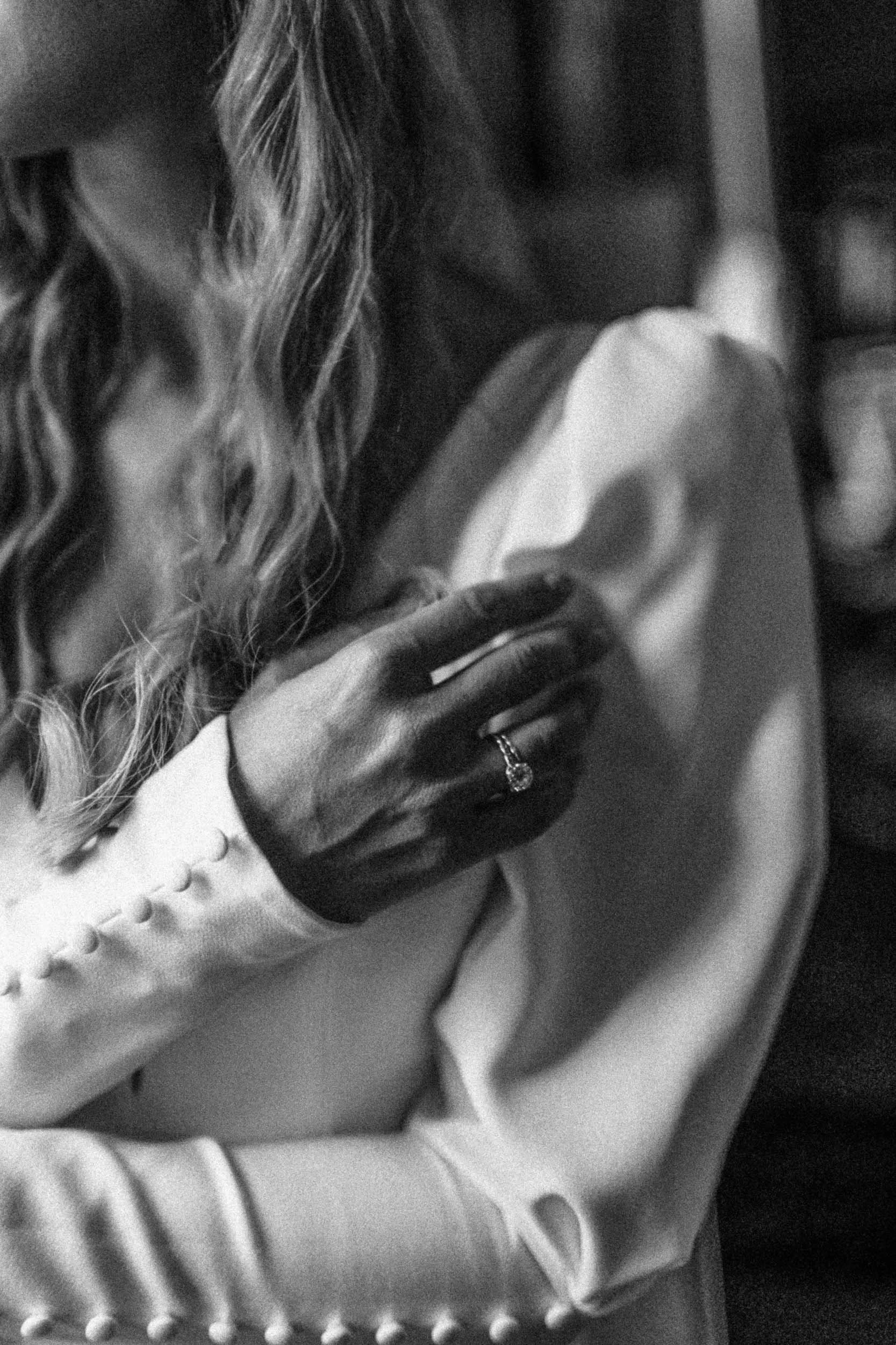 Intimate black and white detail of a bridal dress – timeless editorial wedding moment by Studio Aelina