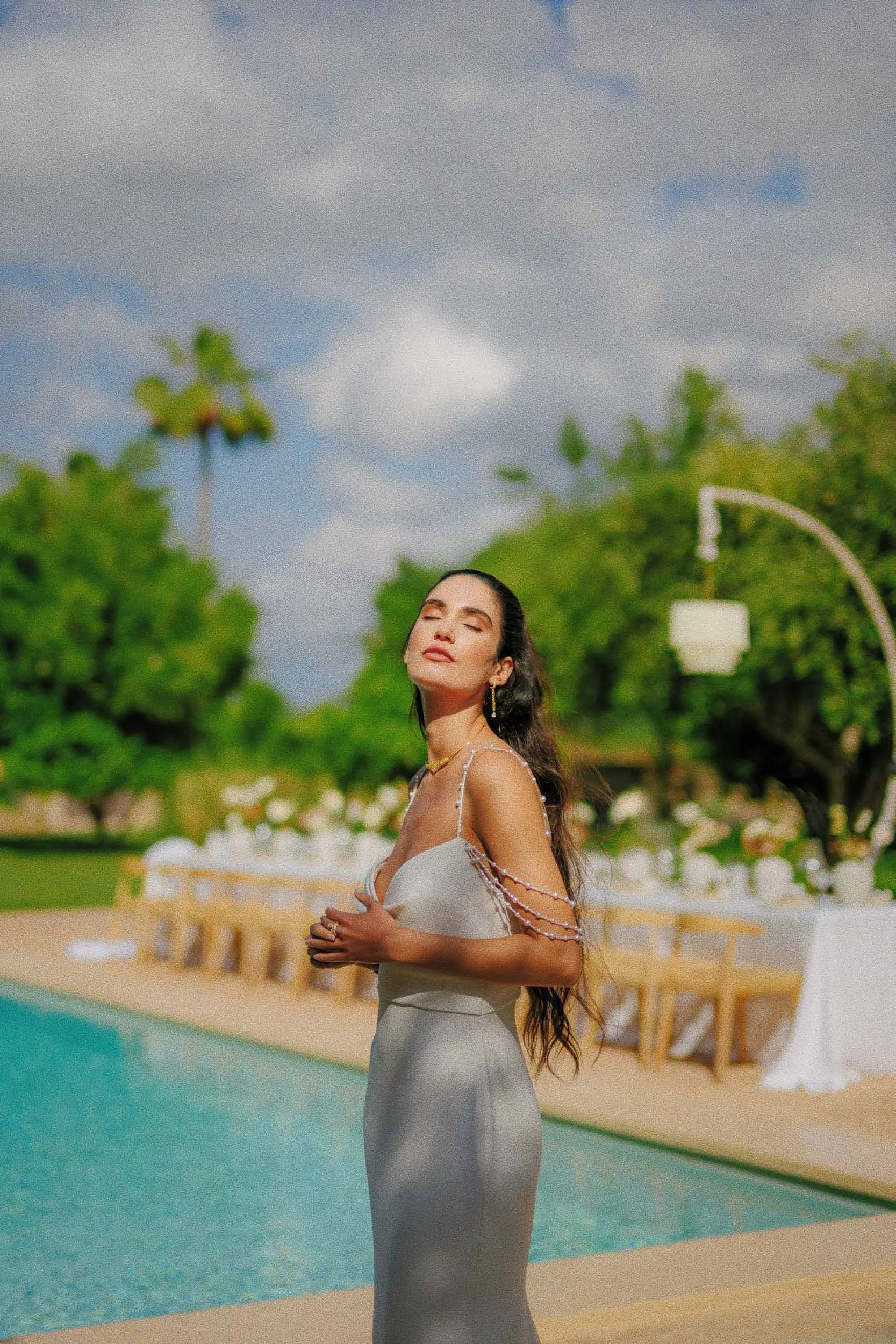 Modern bridal portrait by the pool at a Finca Morneta, Mallorca destination wedding – vibrant and modern photography by Studio Aelina