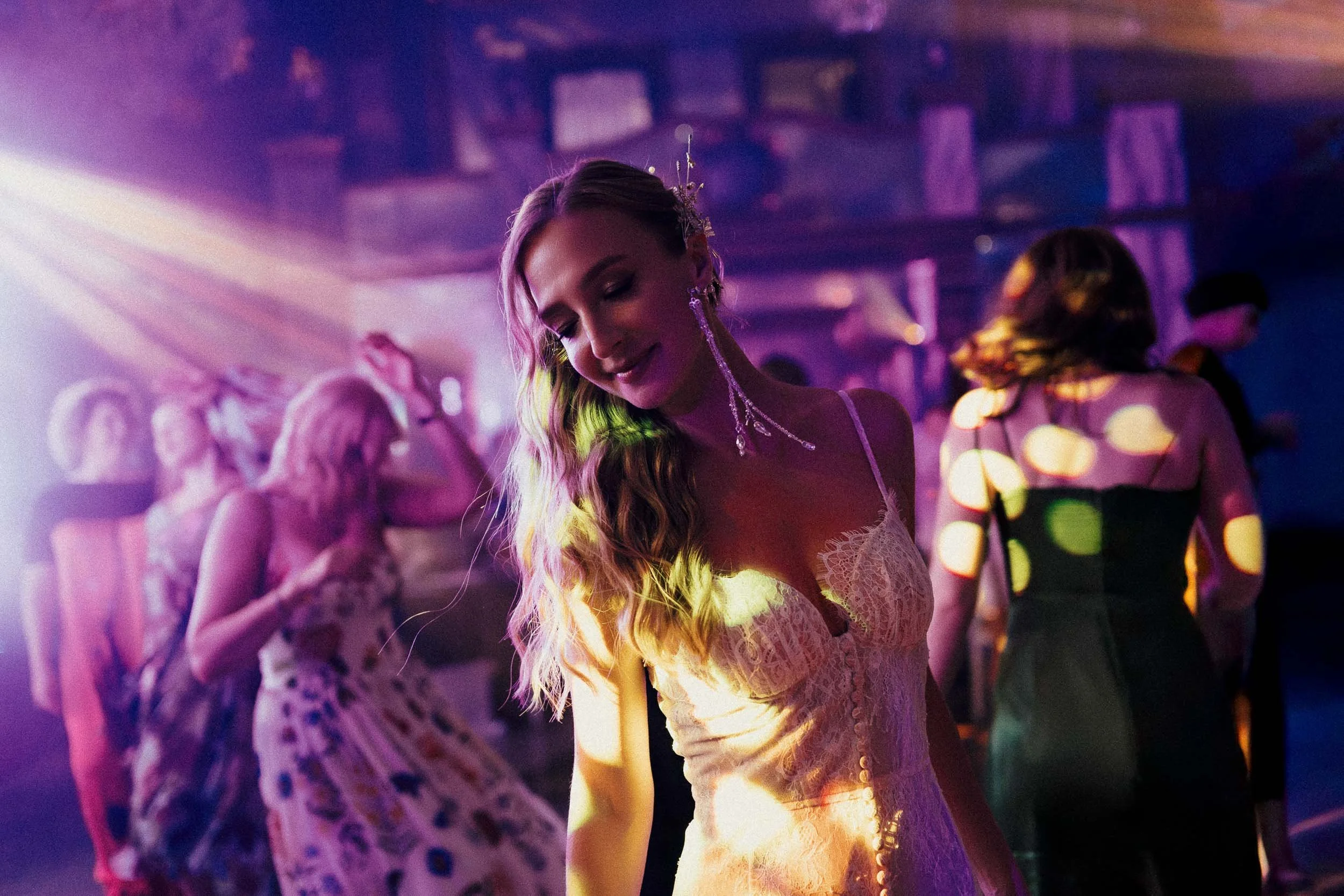 Energetic flash-lit dance floor moment at a wedding in Ukraine – bold, unposed editorial photography by Studio Aelina, published in the New York Times