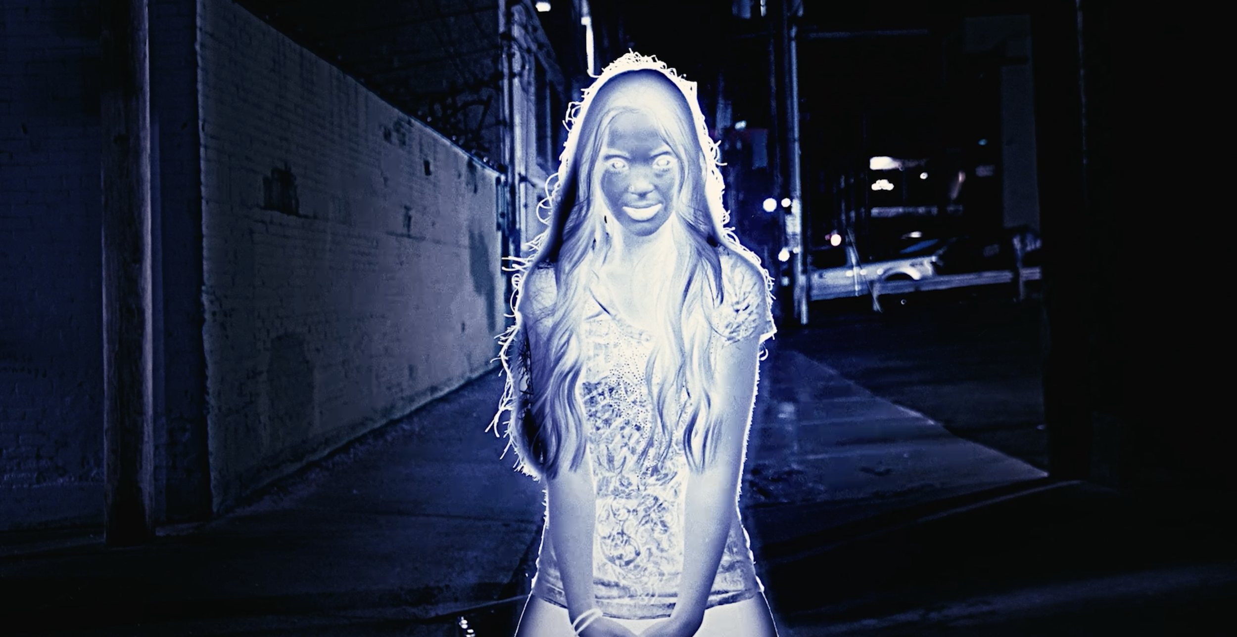 From 'Shadow." Amber glowing in an alleyway.