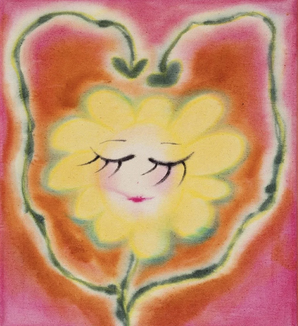 A colorful drawing of a yellow flower with a smiling, feminine face, closed eyes with long eyelashes, pink lips, and surrounded by a green and orange outline, set against a pink background.