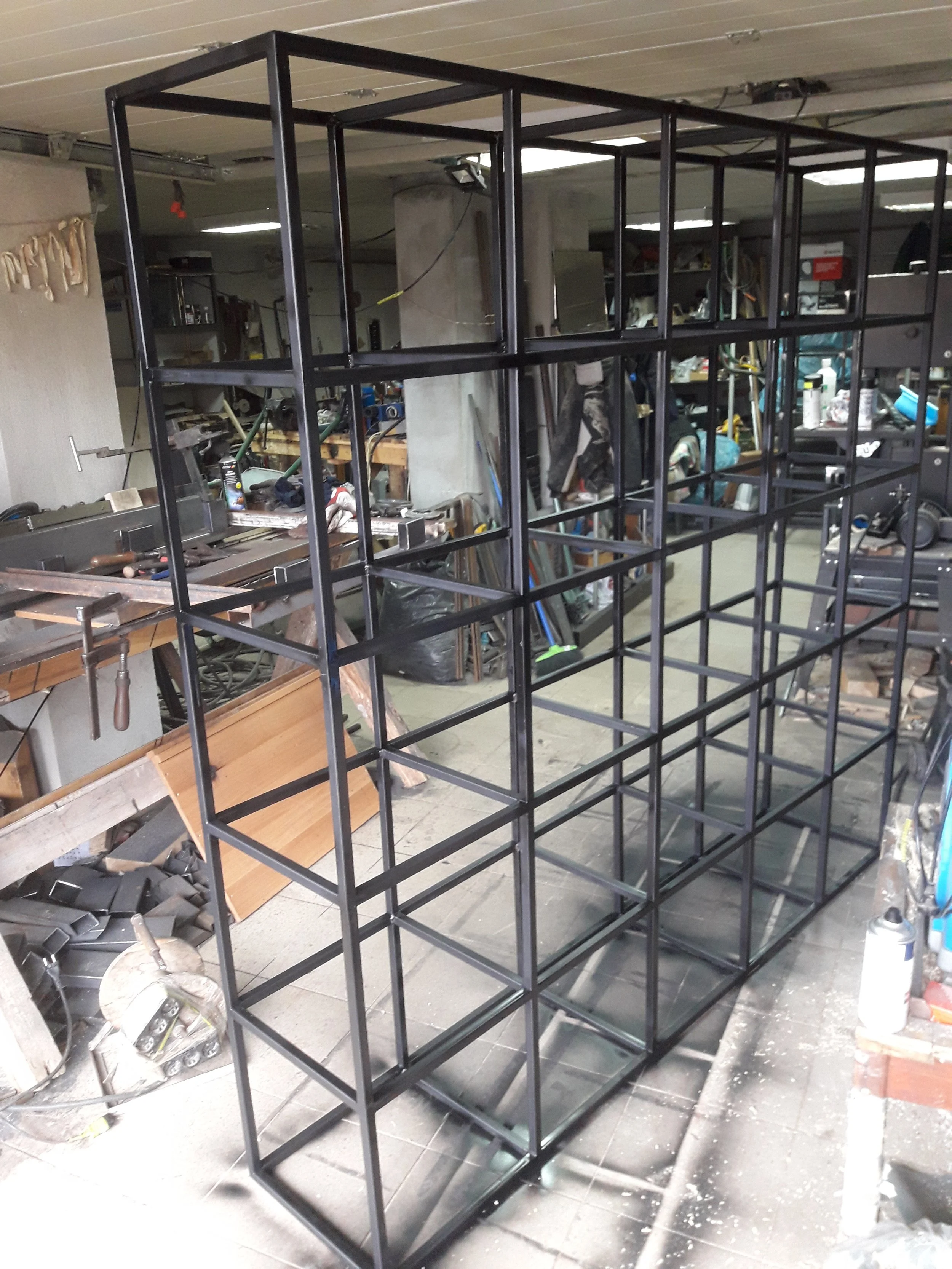Metal shelving unit in workshop under construction
