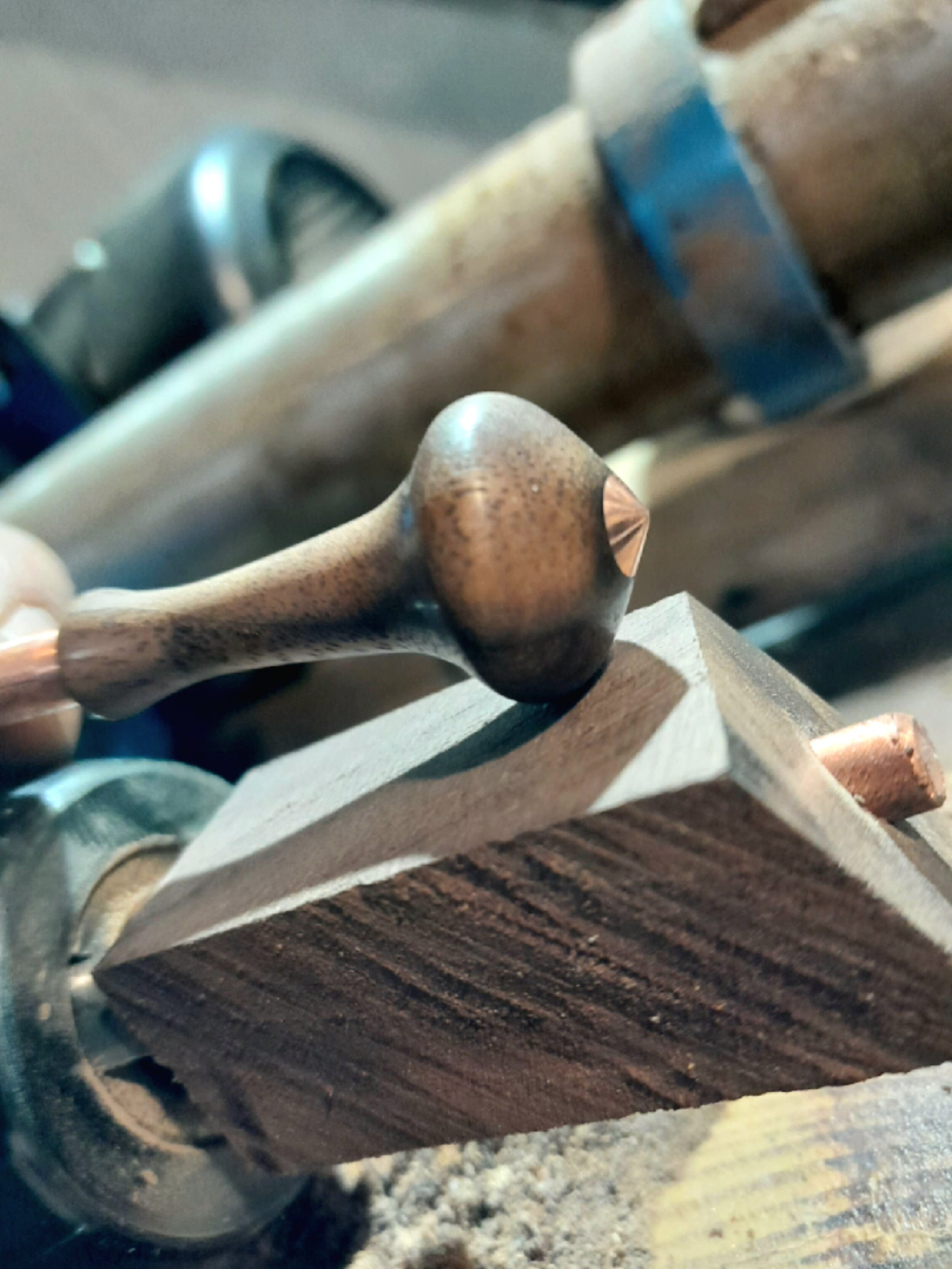 Woodworking lathe with a partially turned wood piece