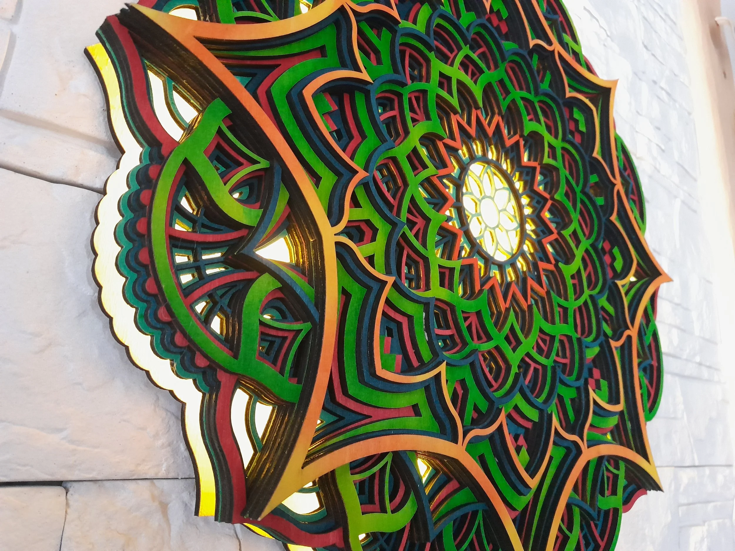 Colorful layered mandala art on a wall