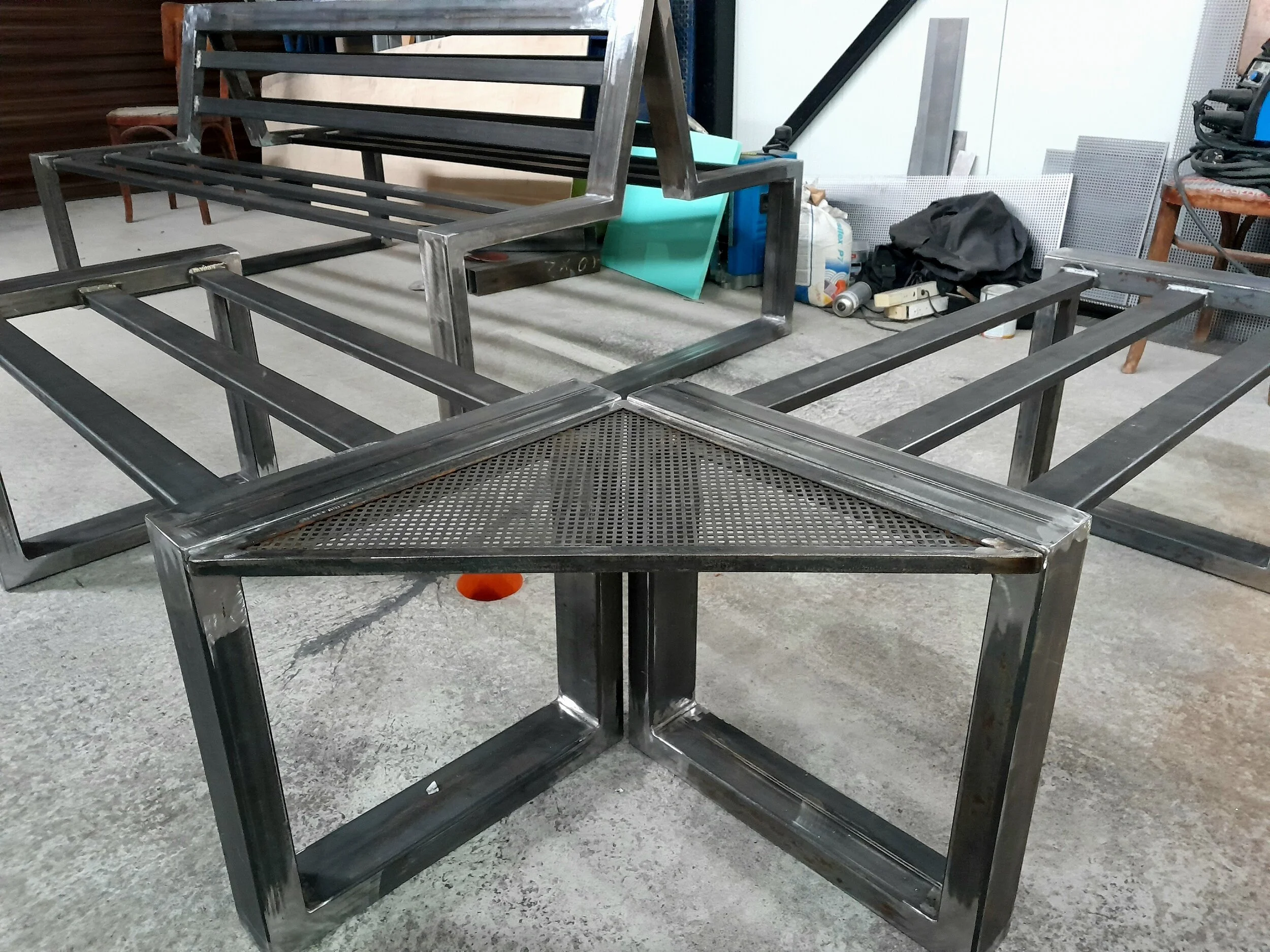 Metal frame of a bench and table set in a workshop
