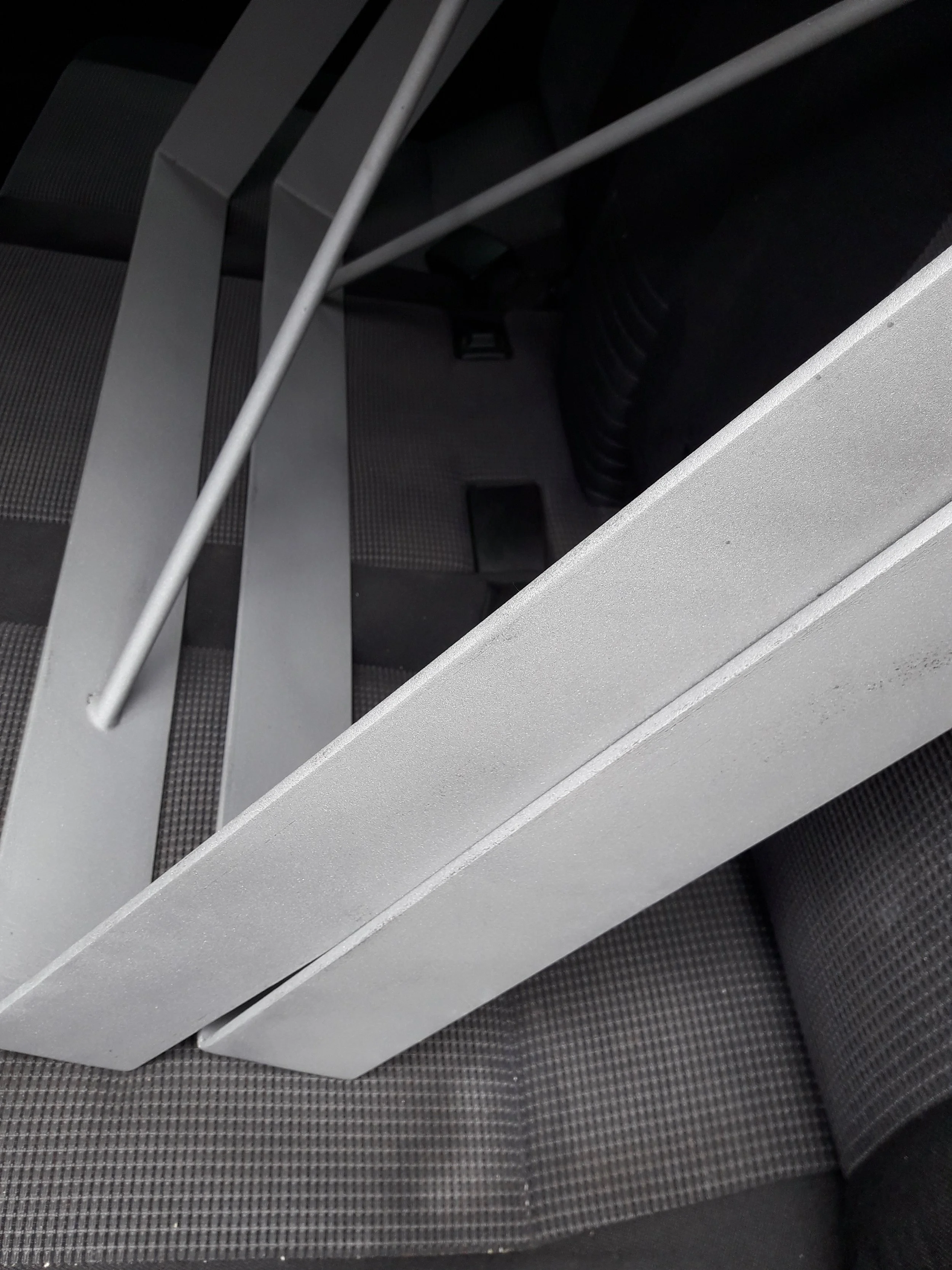 Metal legs and rods on a car seat
