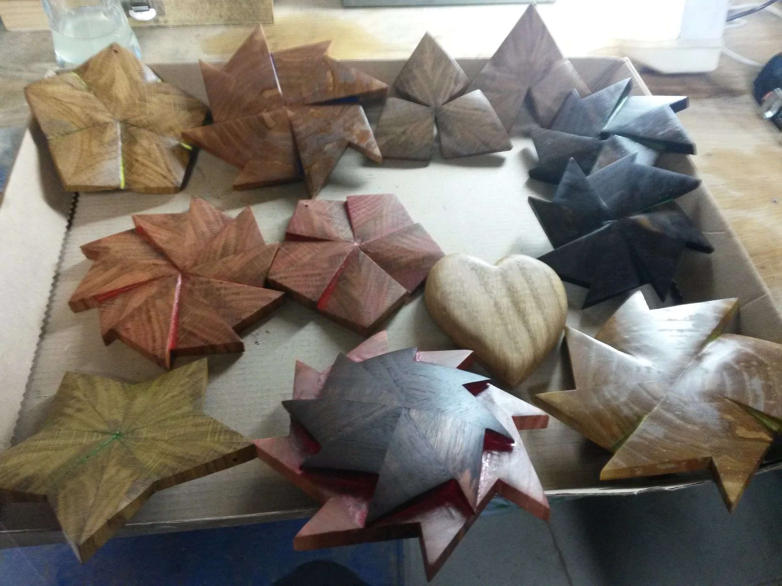 Wooden star and heart-shaped puzzle pieces on a table