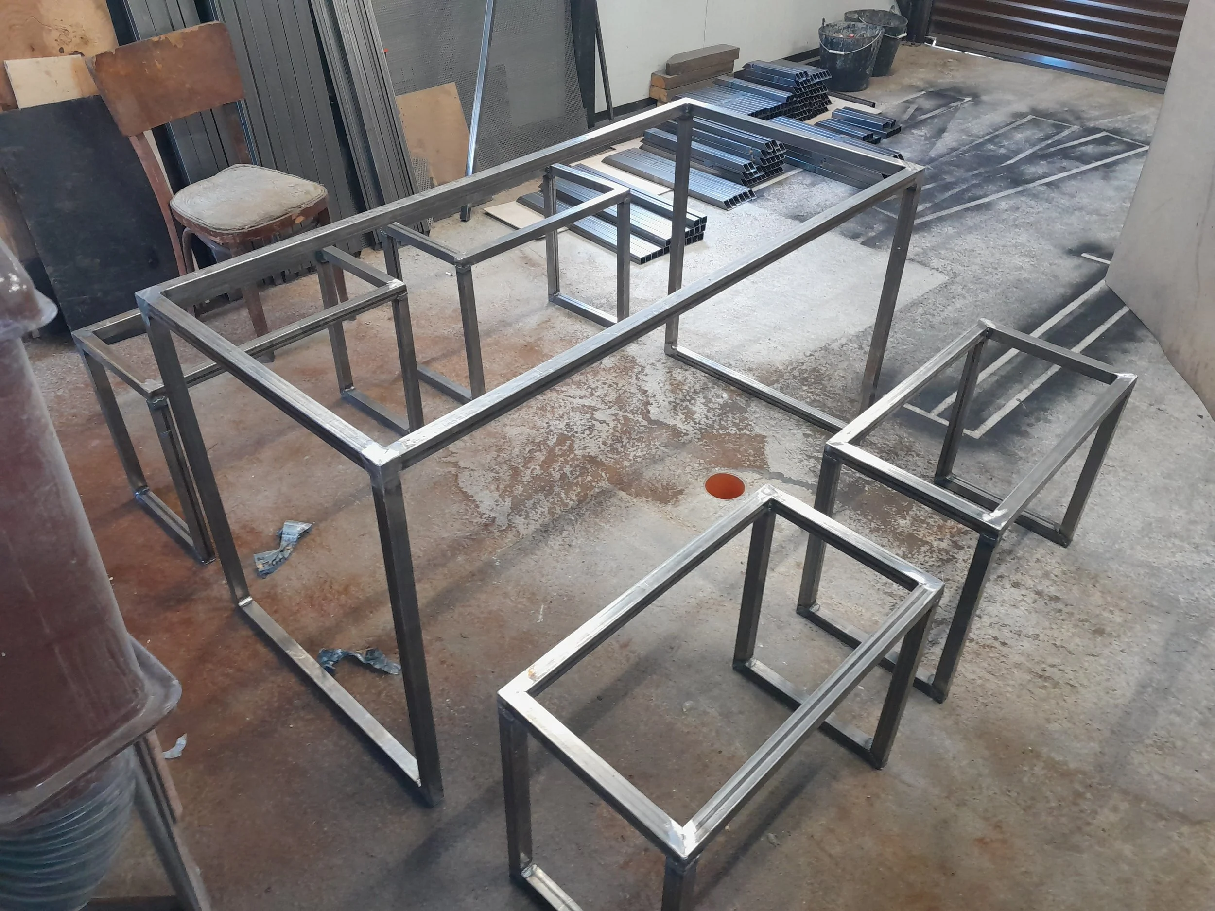 Metal frames for furniture in a workshop