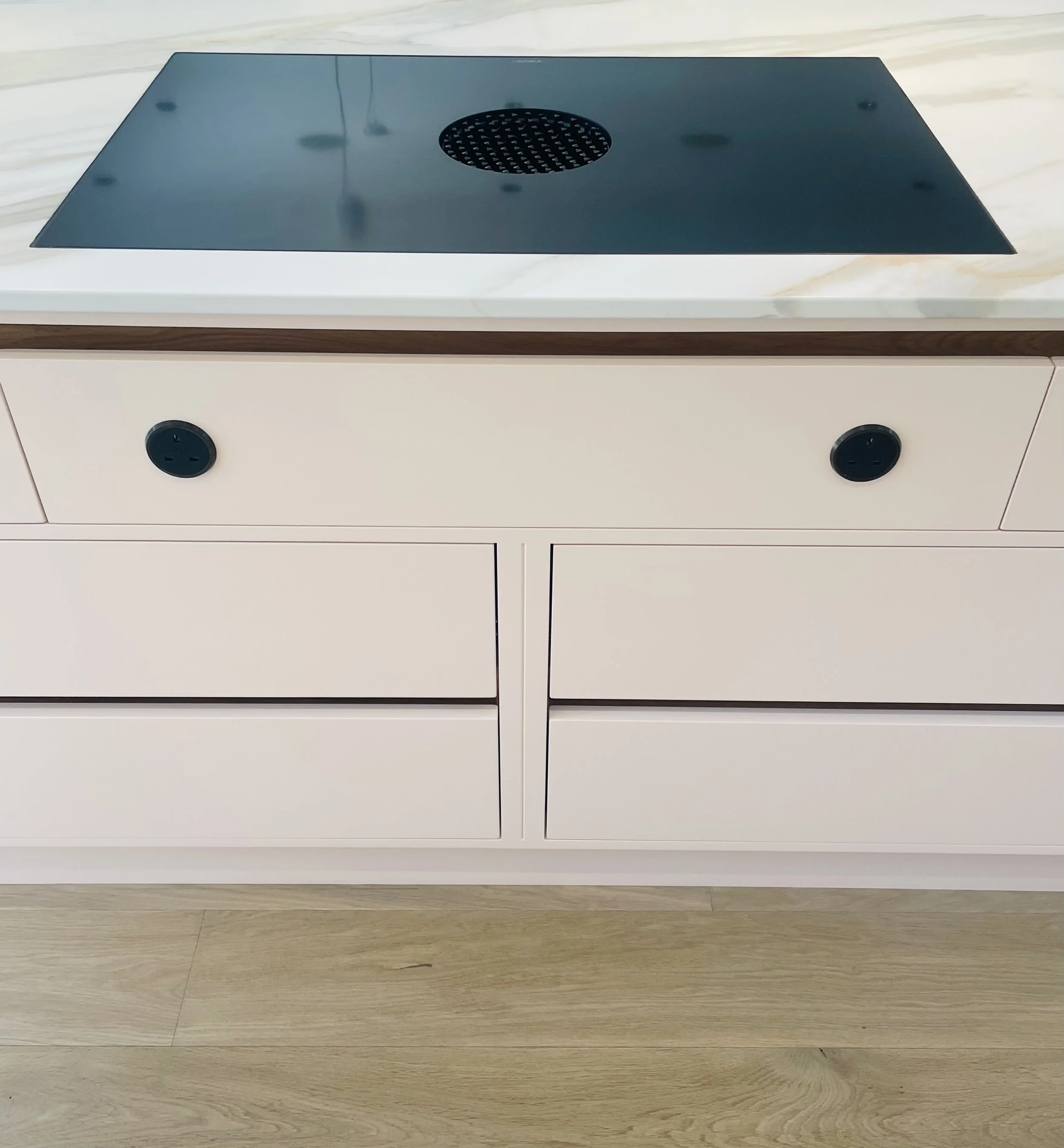 Kitchen countertop with electric outlets and a built-in electric cooktop
