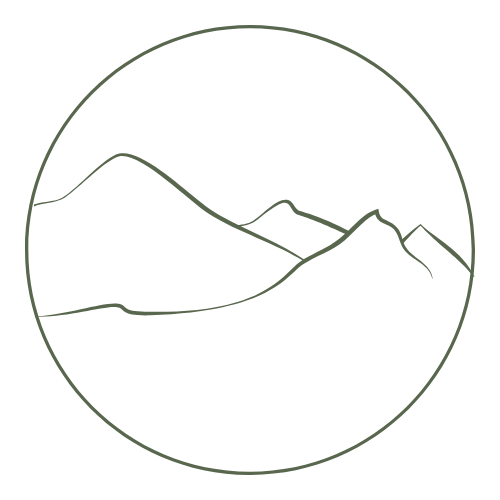 Line drawing of mountains inside a circle.