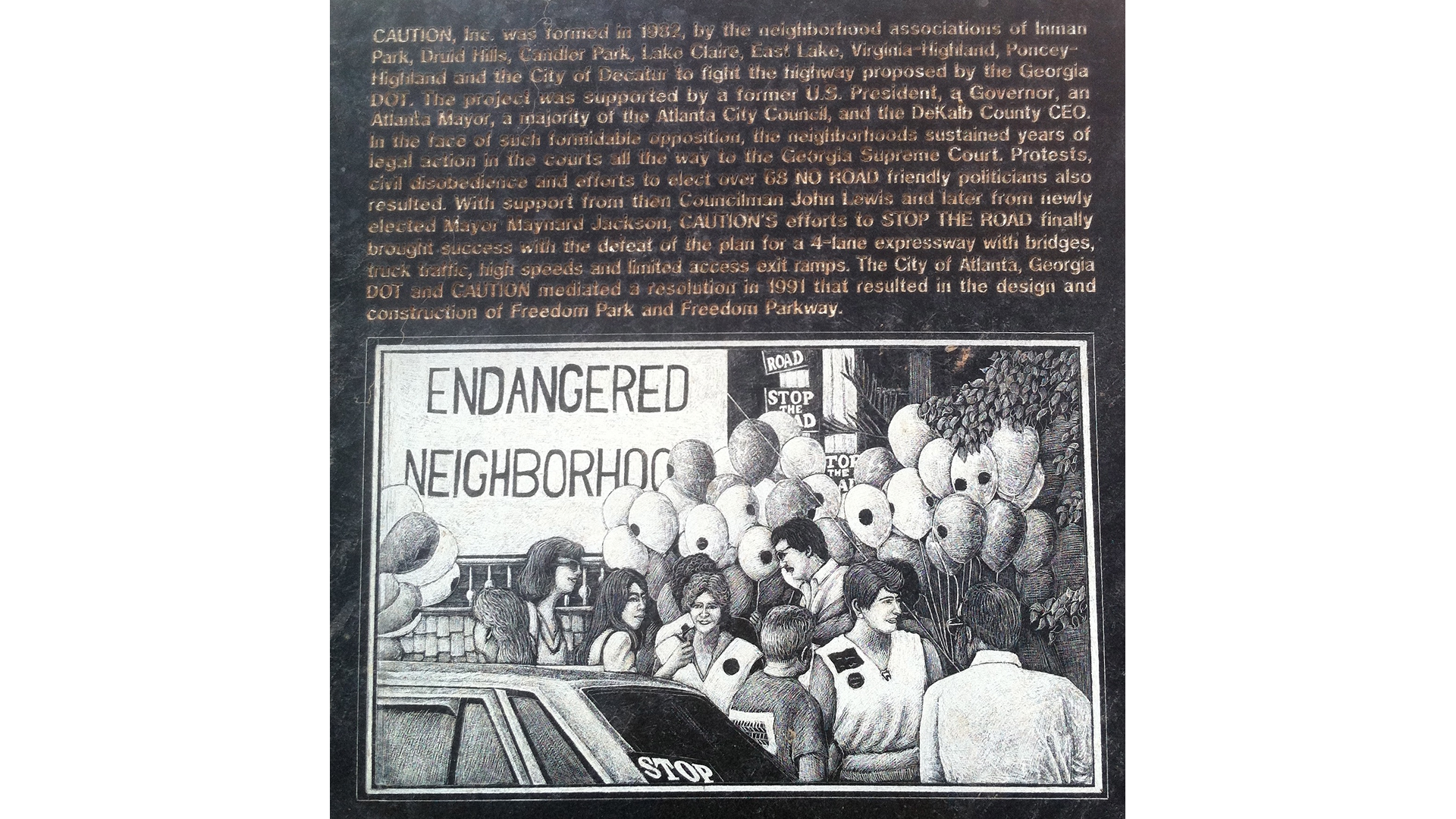 A plaque located in Freedom Park detailing CAUTION’s efforts