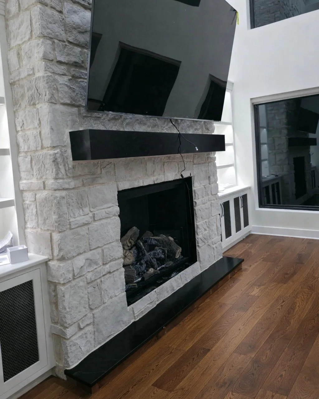 There&rsquo;s nothing better than coming home to a warm, cozy fireplace - especially during our winters! ❄️🔥 

We recently finished this beautiful custom fireplace project, and it couldn&rsquo;t have come at a better time. The clean stonework, custo