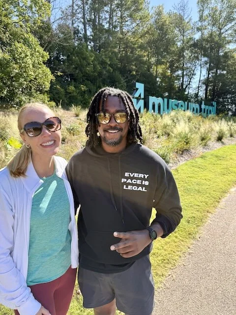 Darley Newman with Tim Orey, Jackson Run Club, on the Museum Trail, enjoying a sunny break along the scenic path that connects Jackson’s cultural landmarks.
