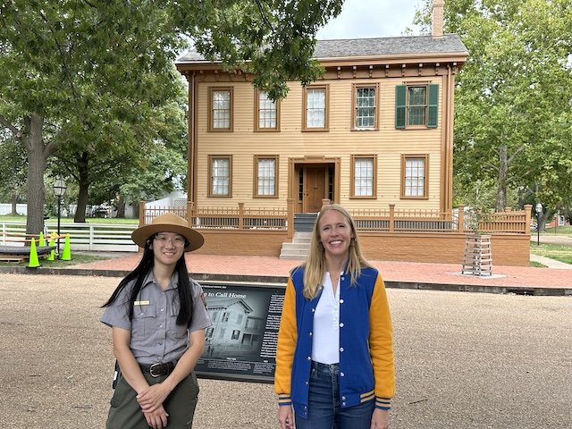 Darley Newman and National Park Ranger Jasmine Leung in front of the Lincoln Home in Springfield, IL.