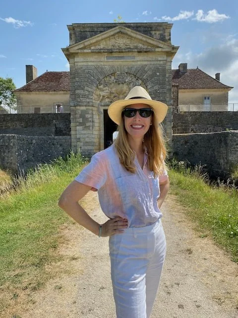 Darley poses in front of a historic building in Bordeaux