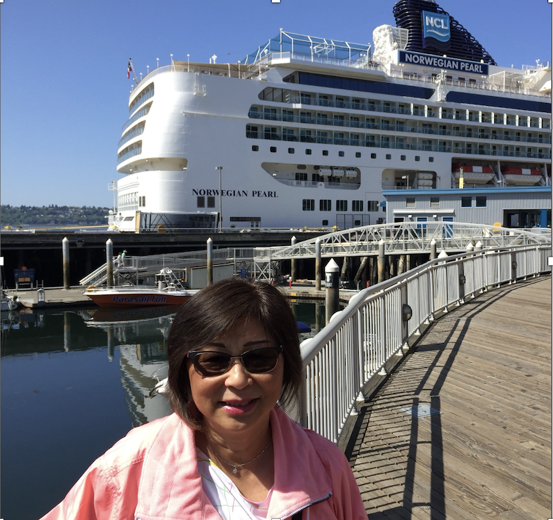 Evelyn in front of the Norwegian Pearl cruise ship