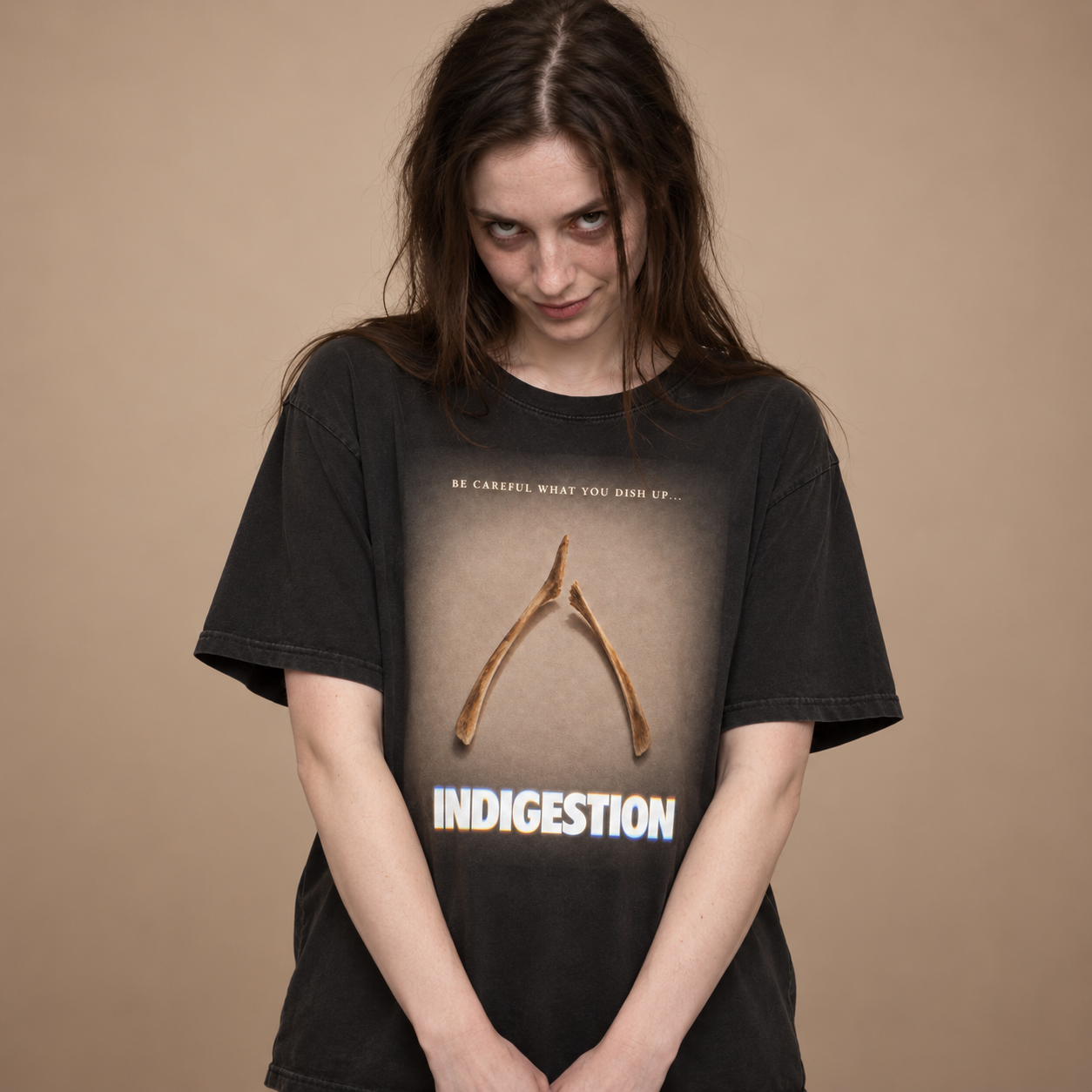 Creepy brunette model wearing a black Comfort Colors 1717 T-shirt featuring the FuHoSh Indigestion broken wishbone Thanksgiving design.