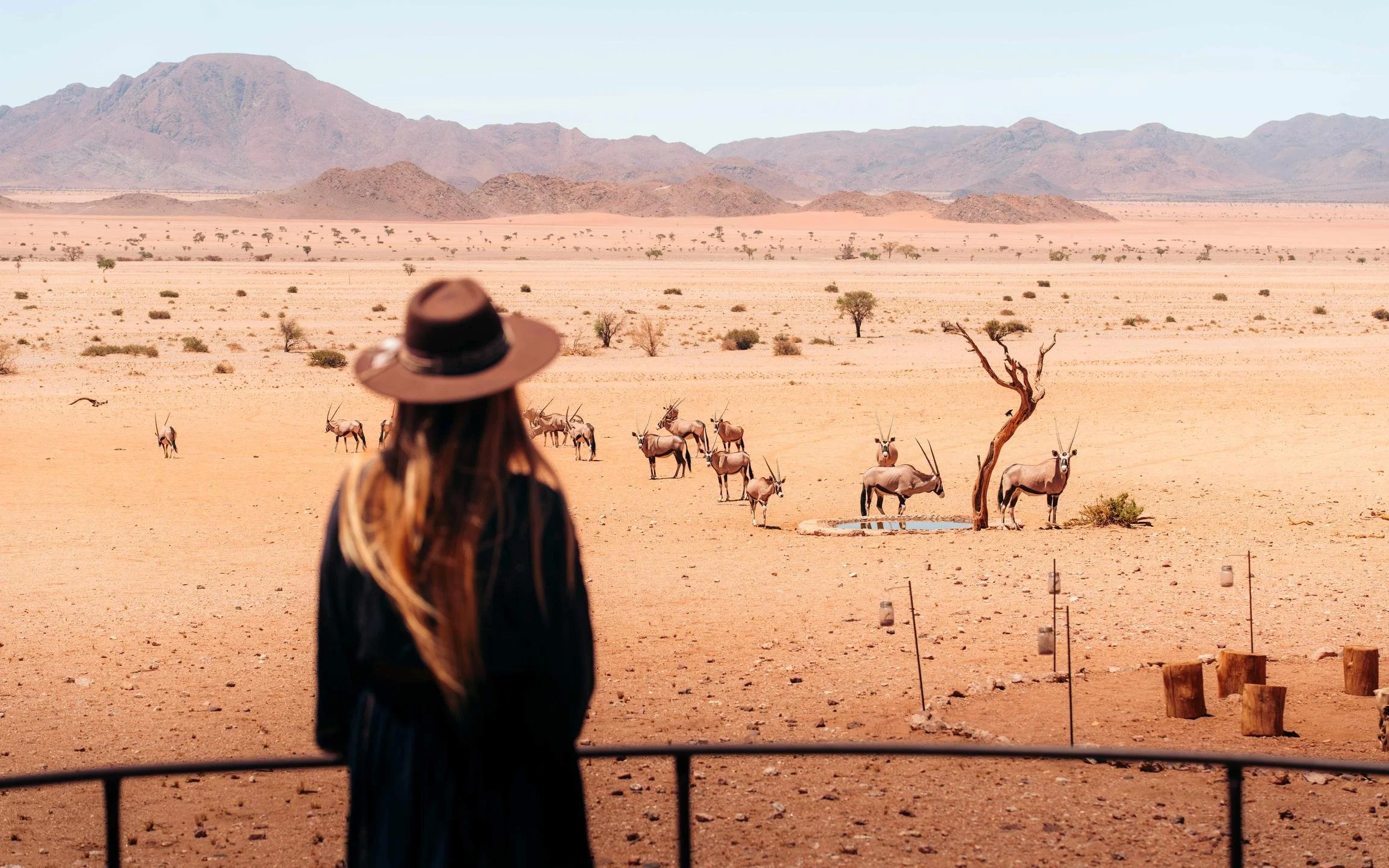 Woman in Namibia at the waterhole
