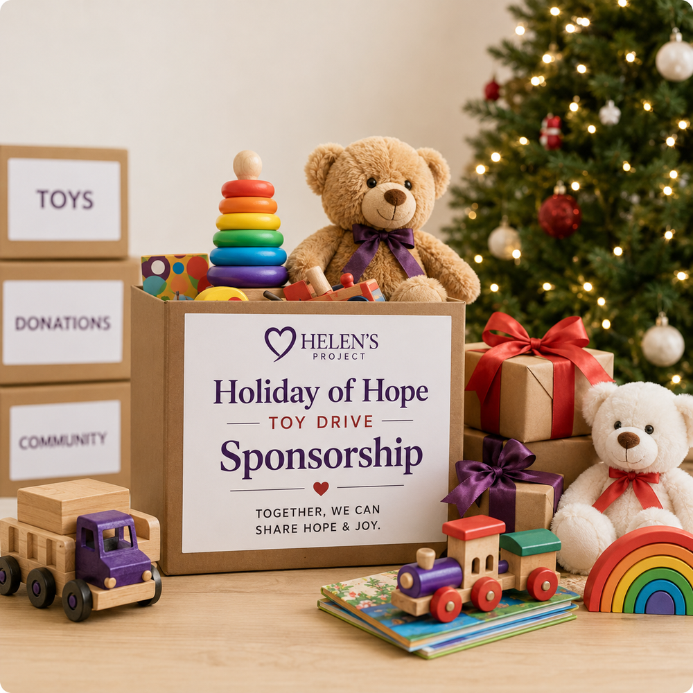 A Holiday of Hope sponsorship donation box filled with new toys, beside wrapped gifts and a decorated tree